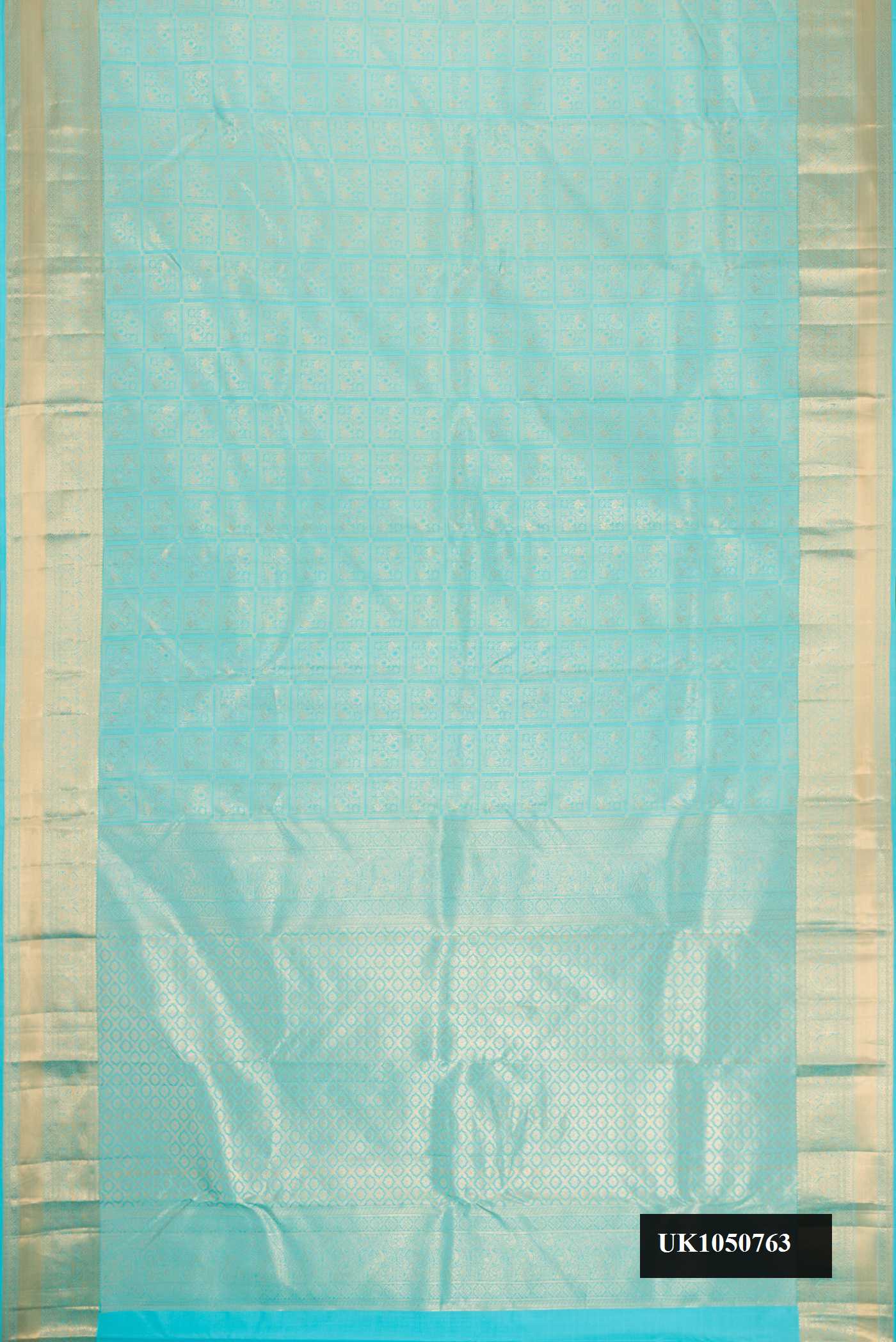 Sky Blue Dual Tone Kanchipuram Silk Saree with Zari Brocade on the body and Zari Border.  displayed on a mannequin