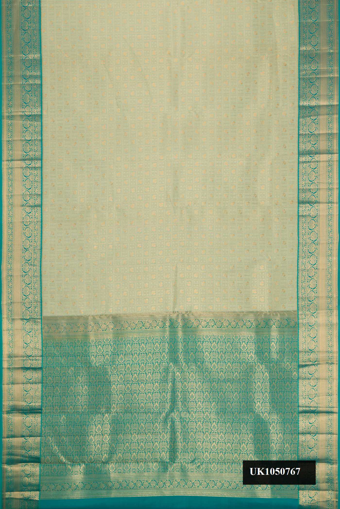 Light Green Dual Tone Kanchipuram Silk Saree with Zari Brocade on the body and Zari Border.  displayed on a mannequin