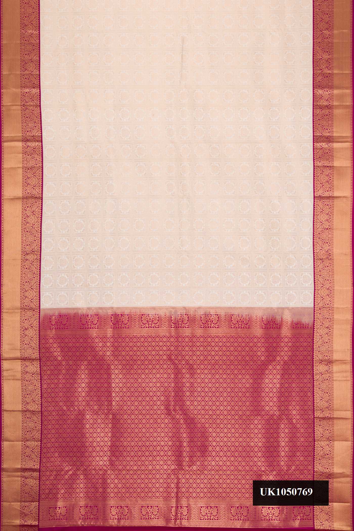 Off White Dual Tone Kanchipuram Silk Saree with Zari Brocade on the body and Zari Border.  displayed on a mannequin