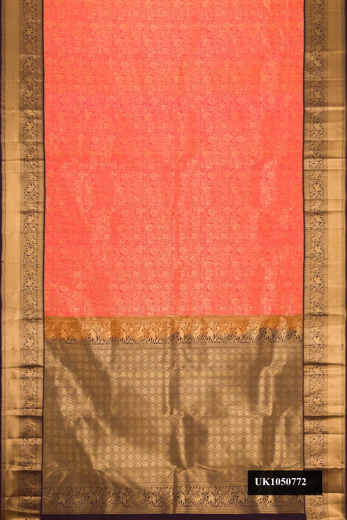 Coral Dual Tone Kanchipuram Silk Saree with Zari Brocade on the body and Zari Border.  displayed on a mannequin