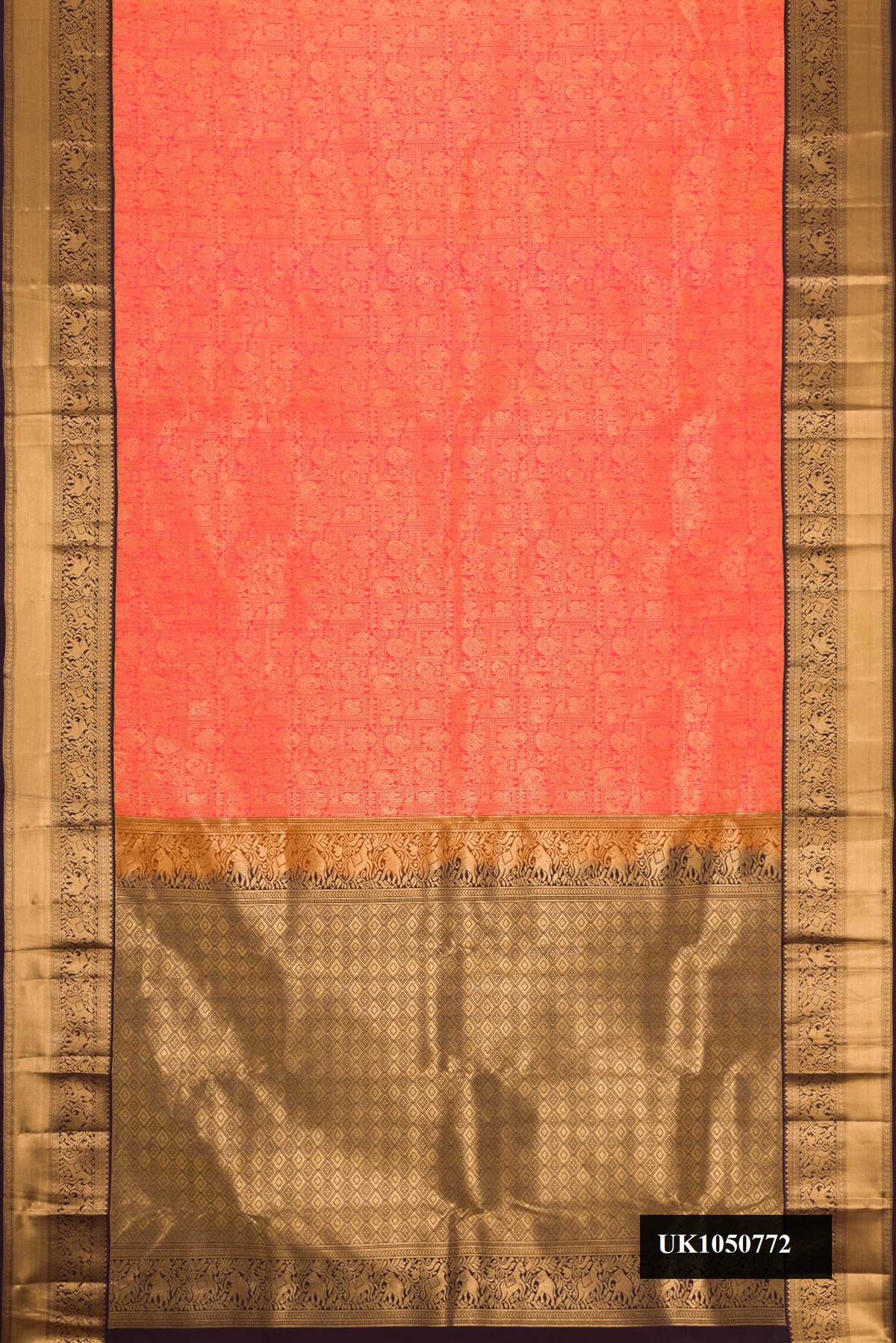 Coral Dual Tone Kanchipuram Silk Saree with Zari Brocade on the body and Zari Border.  displayed on a mannequin