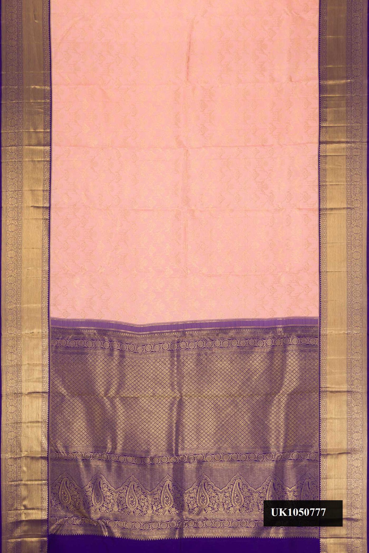 Peach Dual Tone Kanchipuram Silk Saree with Zari Brocade on the body and Zari Border.  displayed on a mannequin