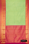 Parrot Green Dual Tone Kanchipuram Silk Saree with Zari Brocade on the body and Zari Border.  displayed on a mannequin