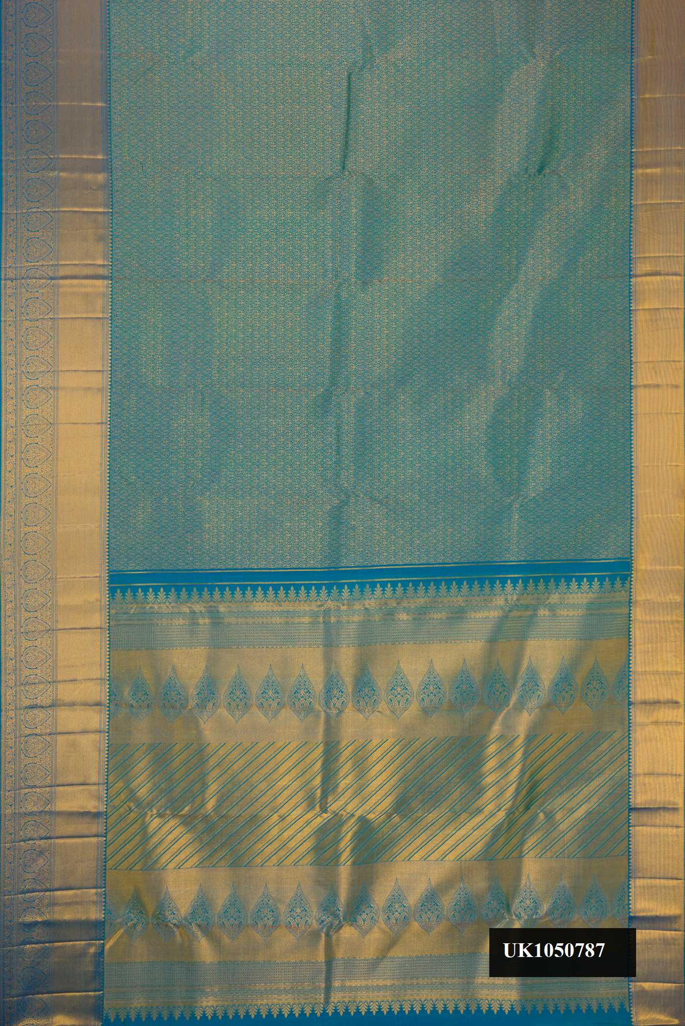 Peacock Blue Dual Tone Kanchipuram Silk Saree with Zari Brocade on the body and Zari Border.  displayed on a mannequin