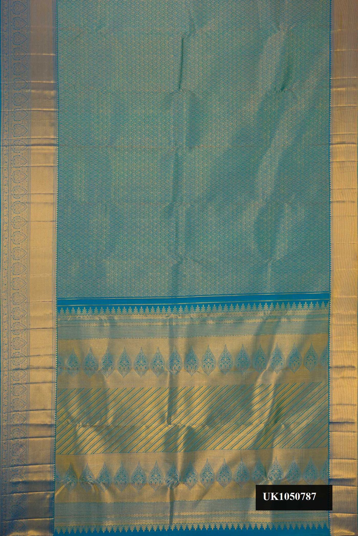 Peacock Blue Dual Tone Kanchipuram Silk Saree with Zari Brocade on the body and Zari Border.  displayed on a mannequin