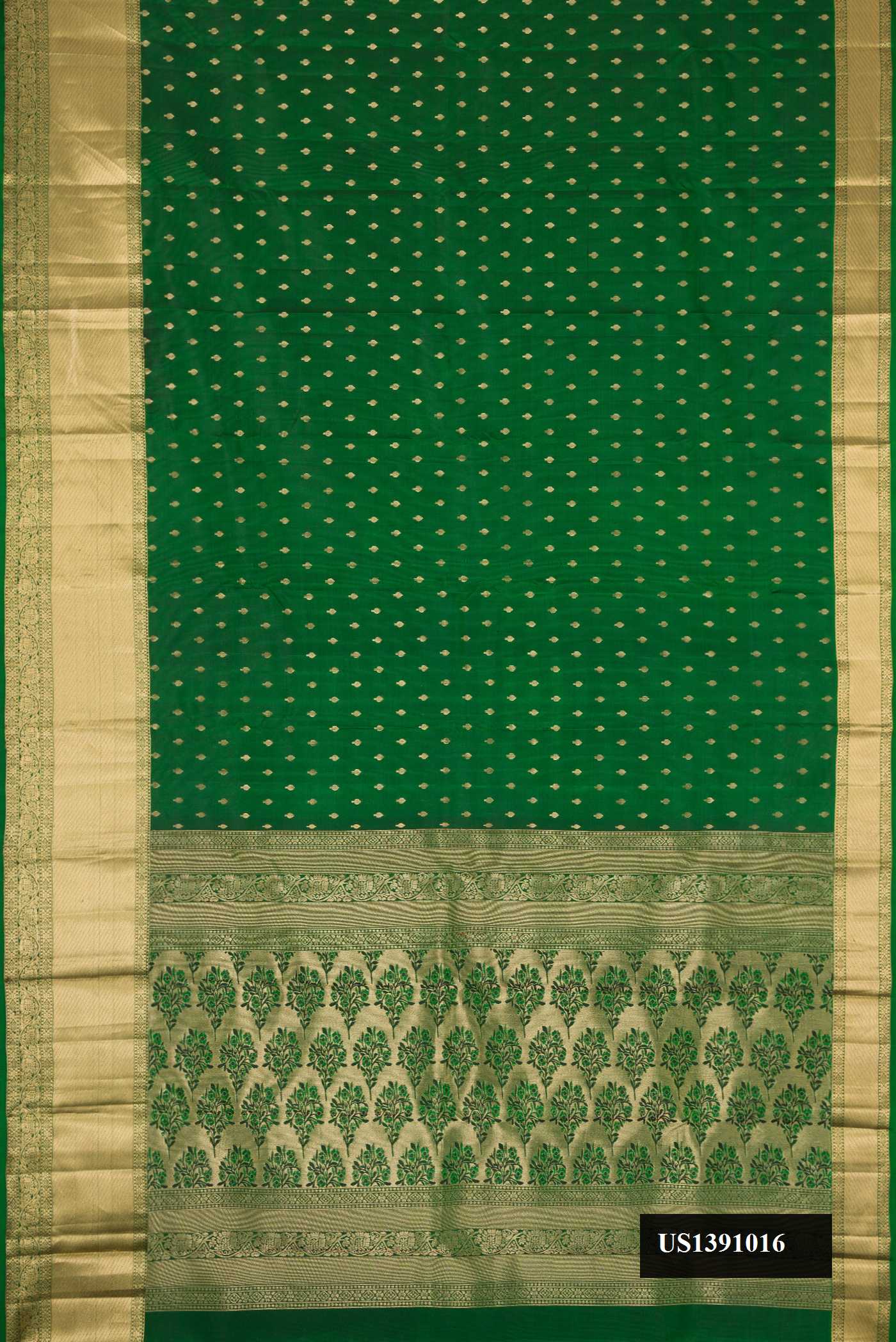 Green Dual Tone Kanchipuram Silk Saree with Zari Butta on the body and Zari Border.  displayed on a mannequin