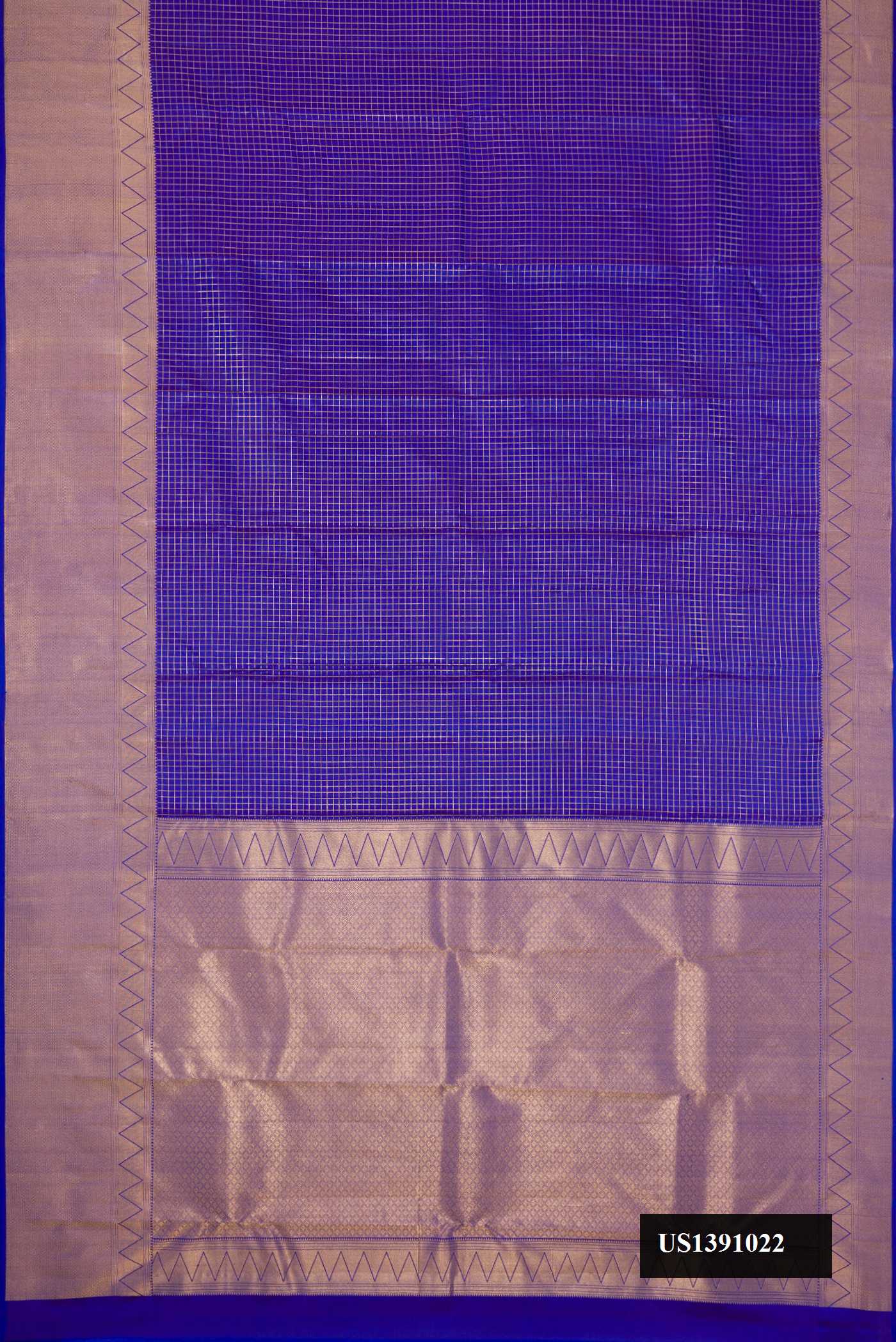 Dark Blue Dual Tone Kanchipuram Silk Saree with Checked design on the body and Zari Border.  displayed on a mannequin