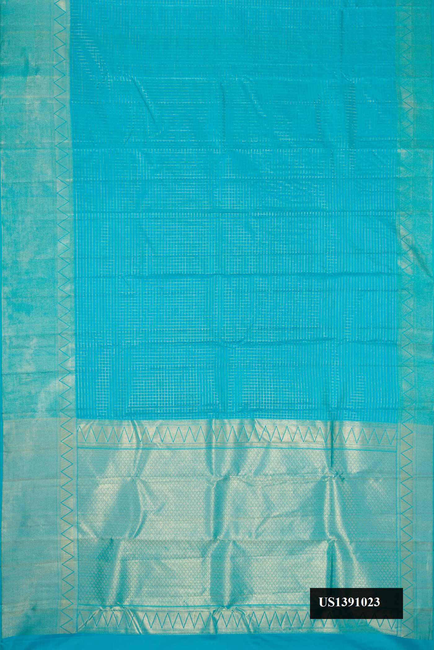 Sky Blue Dual Tone Kanchipuram Silk Saree with Checked design on the body and Zari Border.  displayed on a mannequin