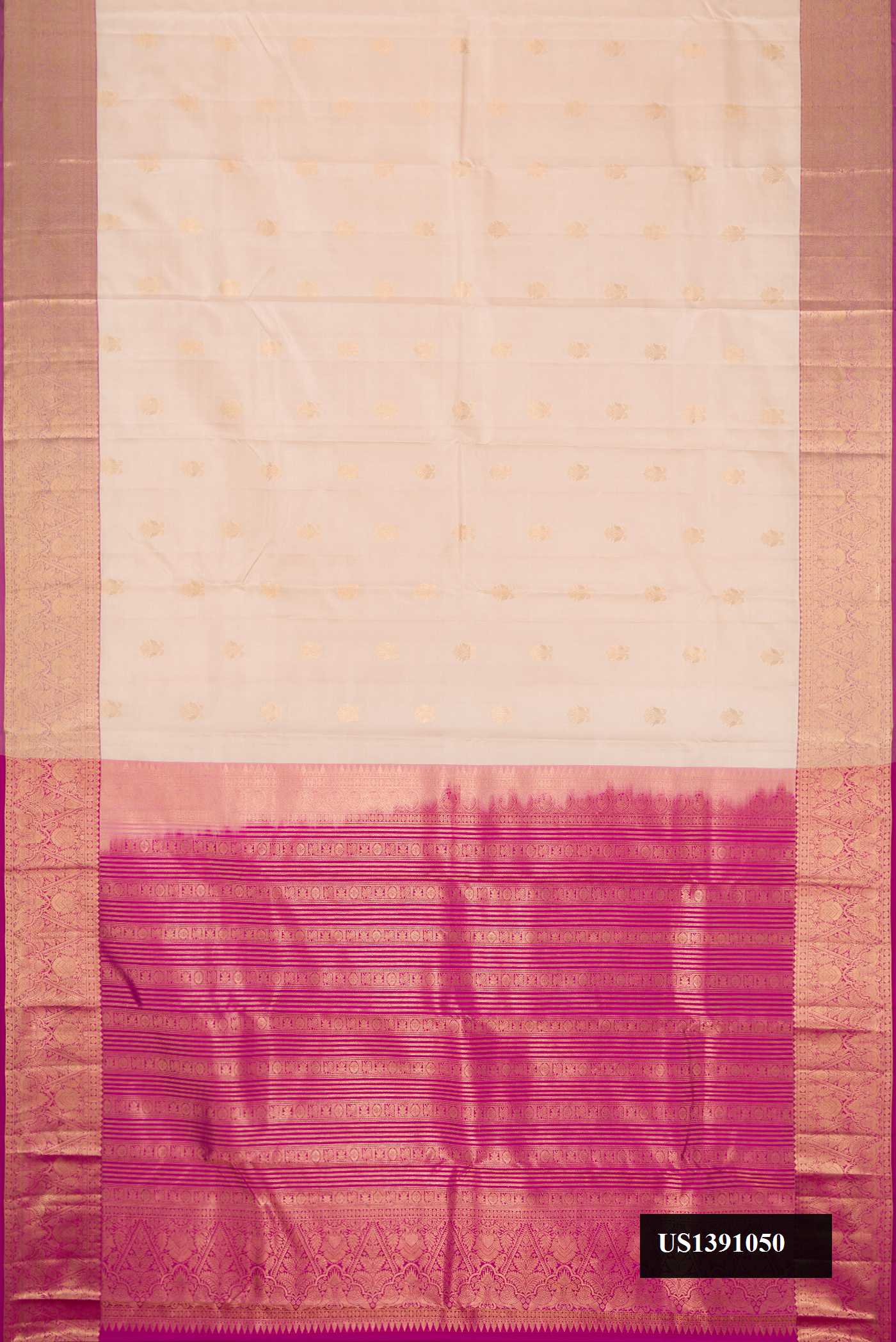 Beige Dual Tone Kanchipuram Silk Saree with Zari Butta on the body and Zari Border.  displayed on a mannequin