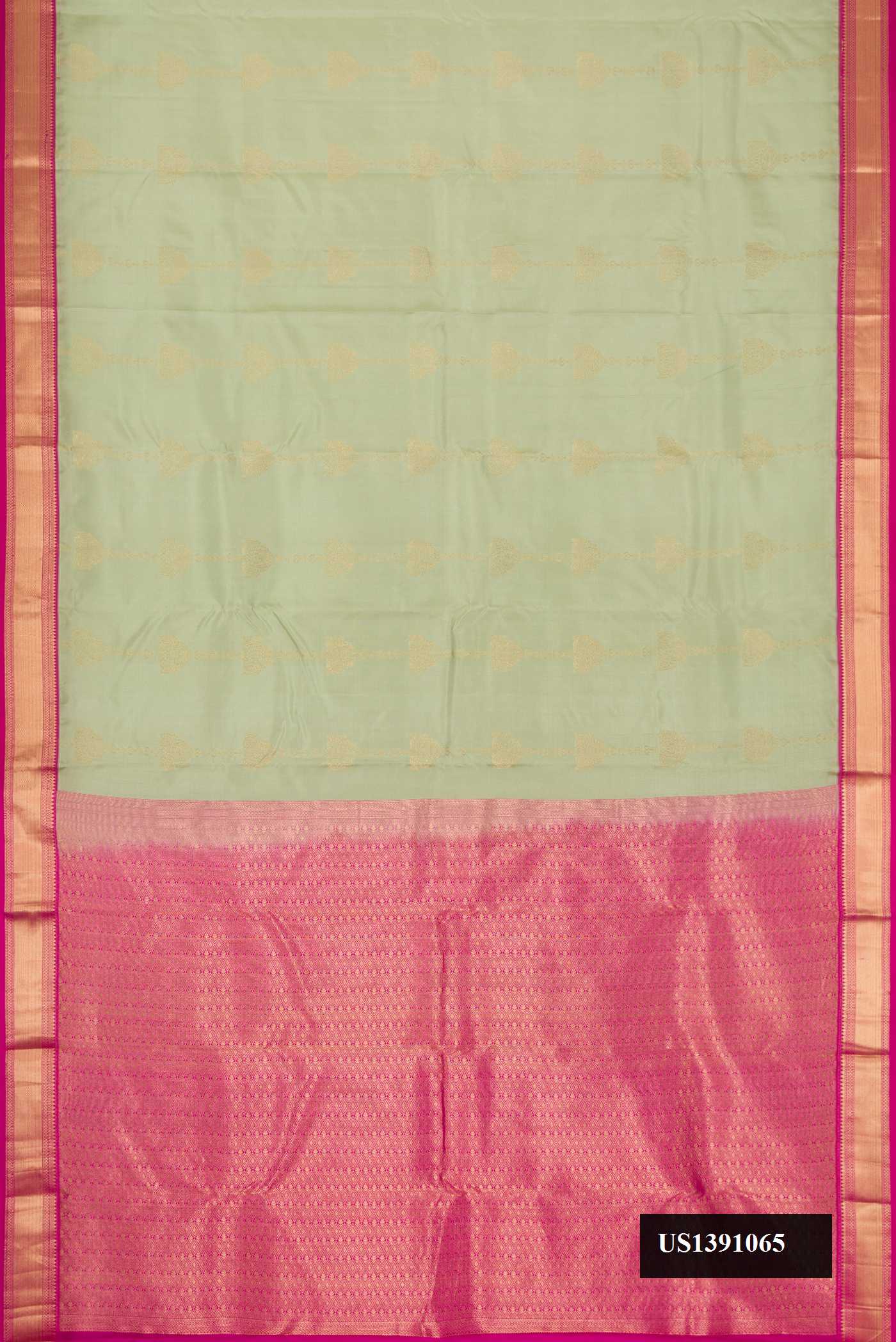 Pista Green Dual Tone Kanchipuram Silk Saree with Stripes on the body and Zari Border.  displayed on a mannequin