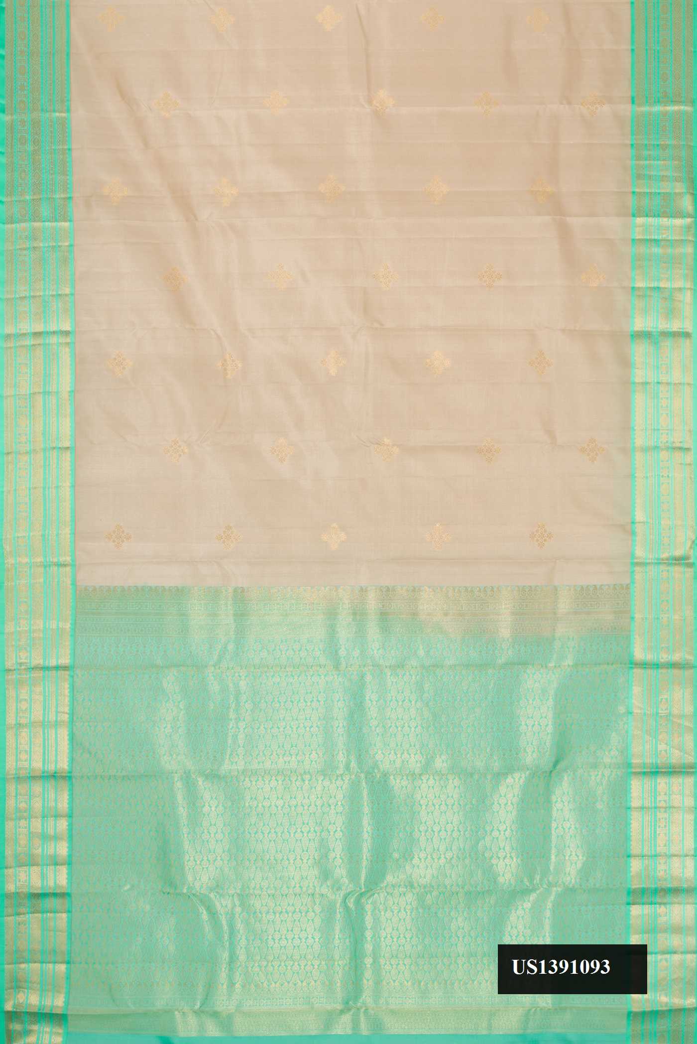 Beige Dual Tone Kanchipuram Silk Saree with Zari Butta on the body and Zari Border.  displayed on a mannequin