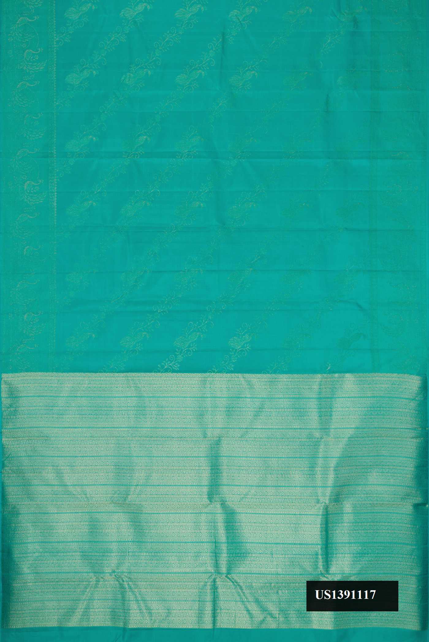 Green Dual Tone Kanchipuram Silk Saree with Zari Butta on the body and Zari Border.  displayed on a mannequin