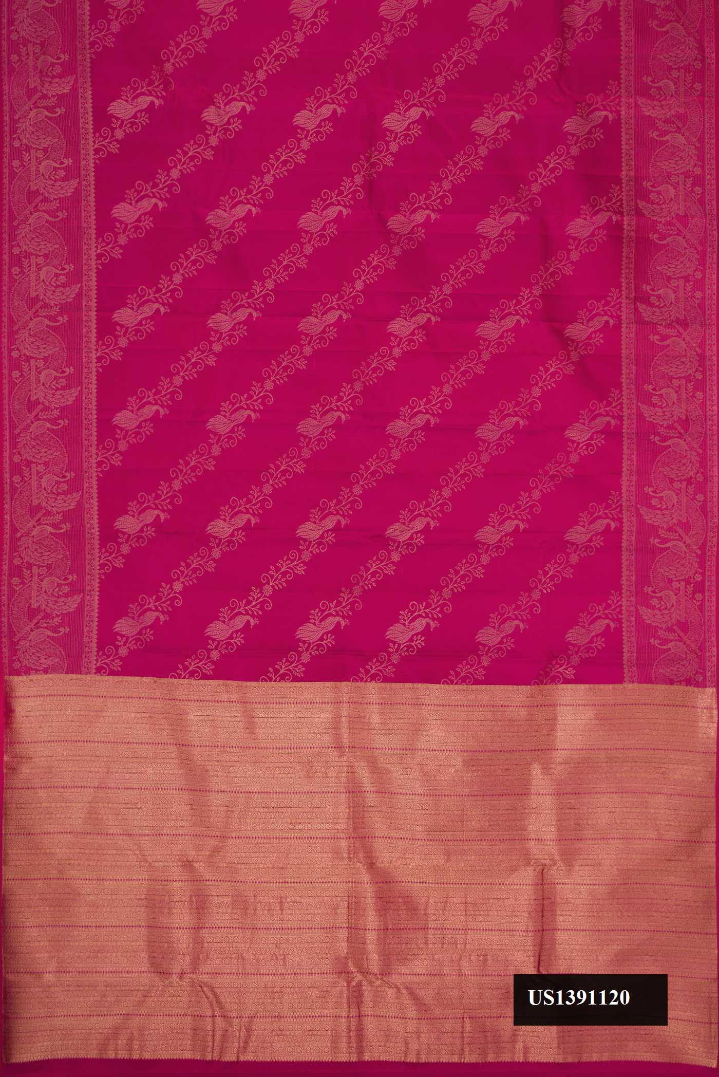 Magenta Dual Tone Kanchipuram Silk Saree with Zari Butta on the body and Fancy Border.  displayed on a mannequin