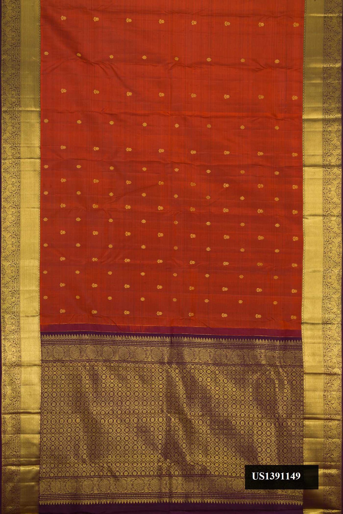 Orange Dual Tone Kanchipuram Silk Saree with Zari Butta on the body and Zari Border.  displayed on a mannequin