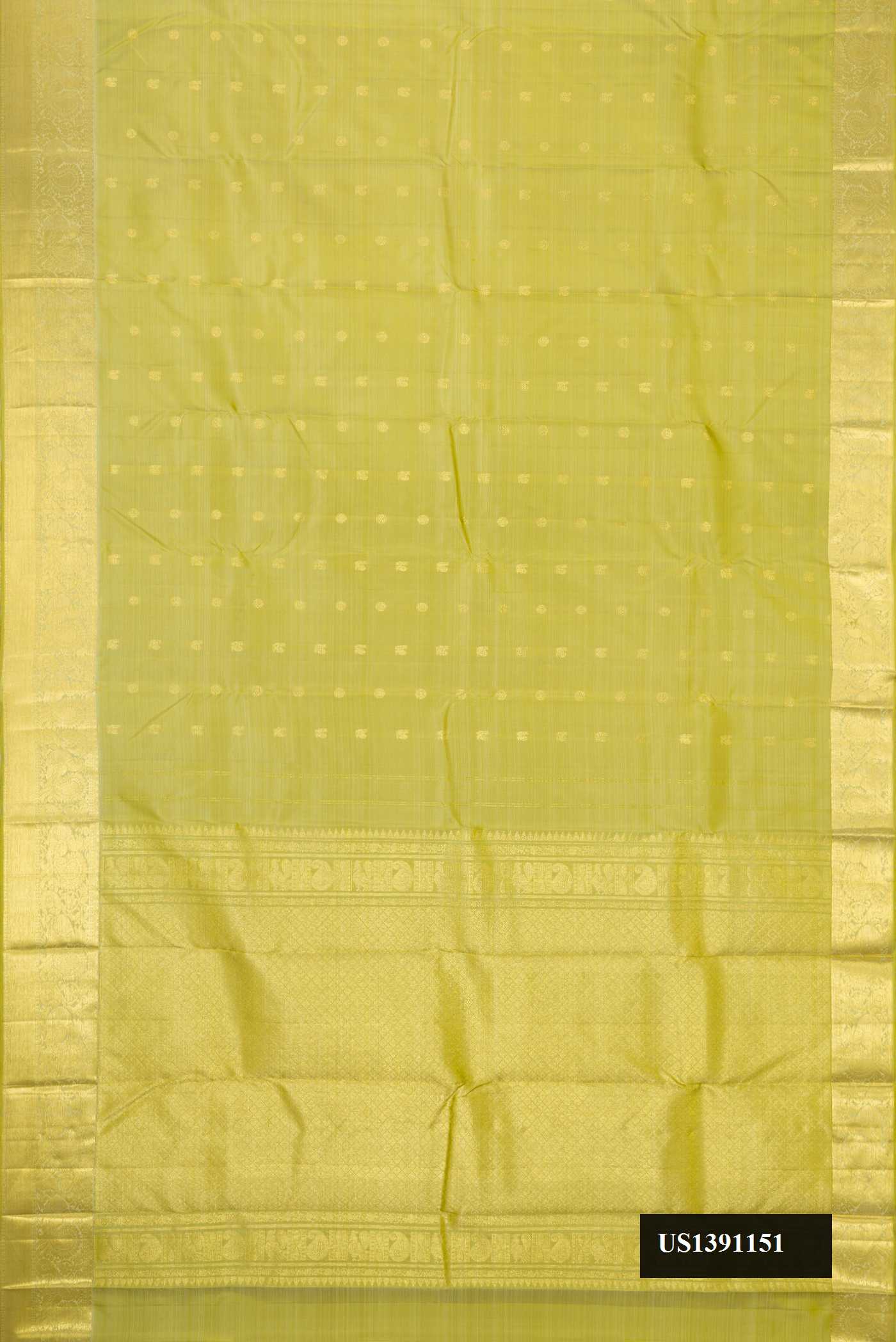 Green Dual Tone Kanchipuram Silk Saree with Zari Butta on the body and Zari Border.  displayed on a mannequin