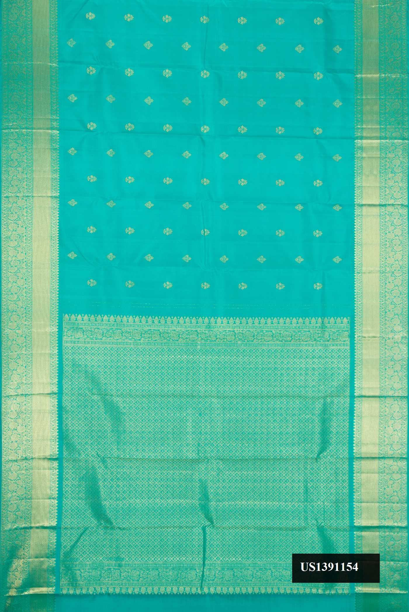 Green Dual Tone Kanchipuram Silk Saree with Zari Butta on the body and Zari Border.  displayed on a mannequin