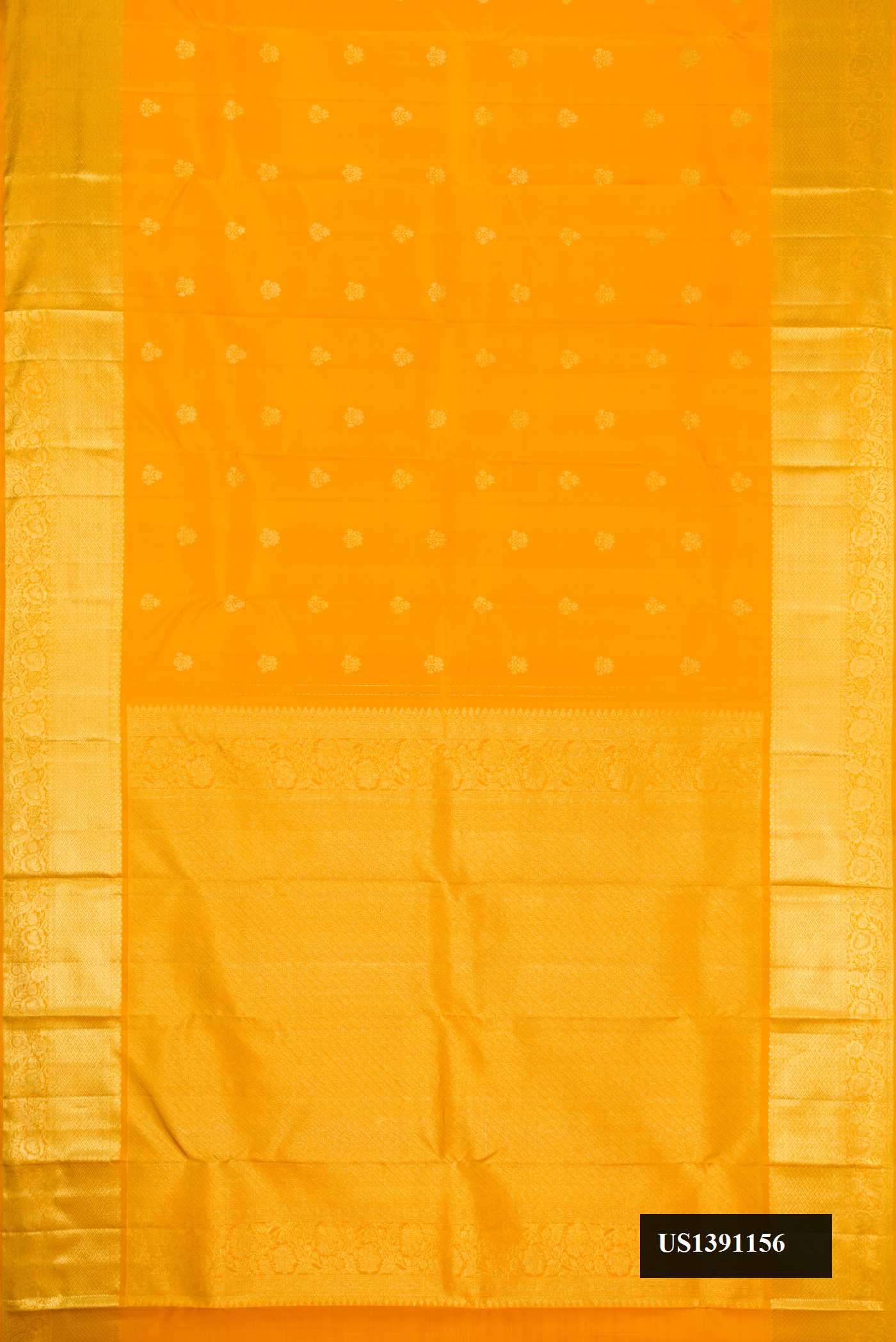 Mustard Dual Tone Kanchipuram Silk Saree with Zari Butta on the body and Zari Border.  displayed on a mannequin