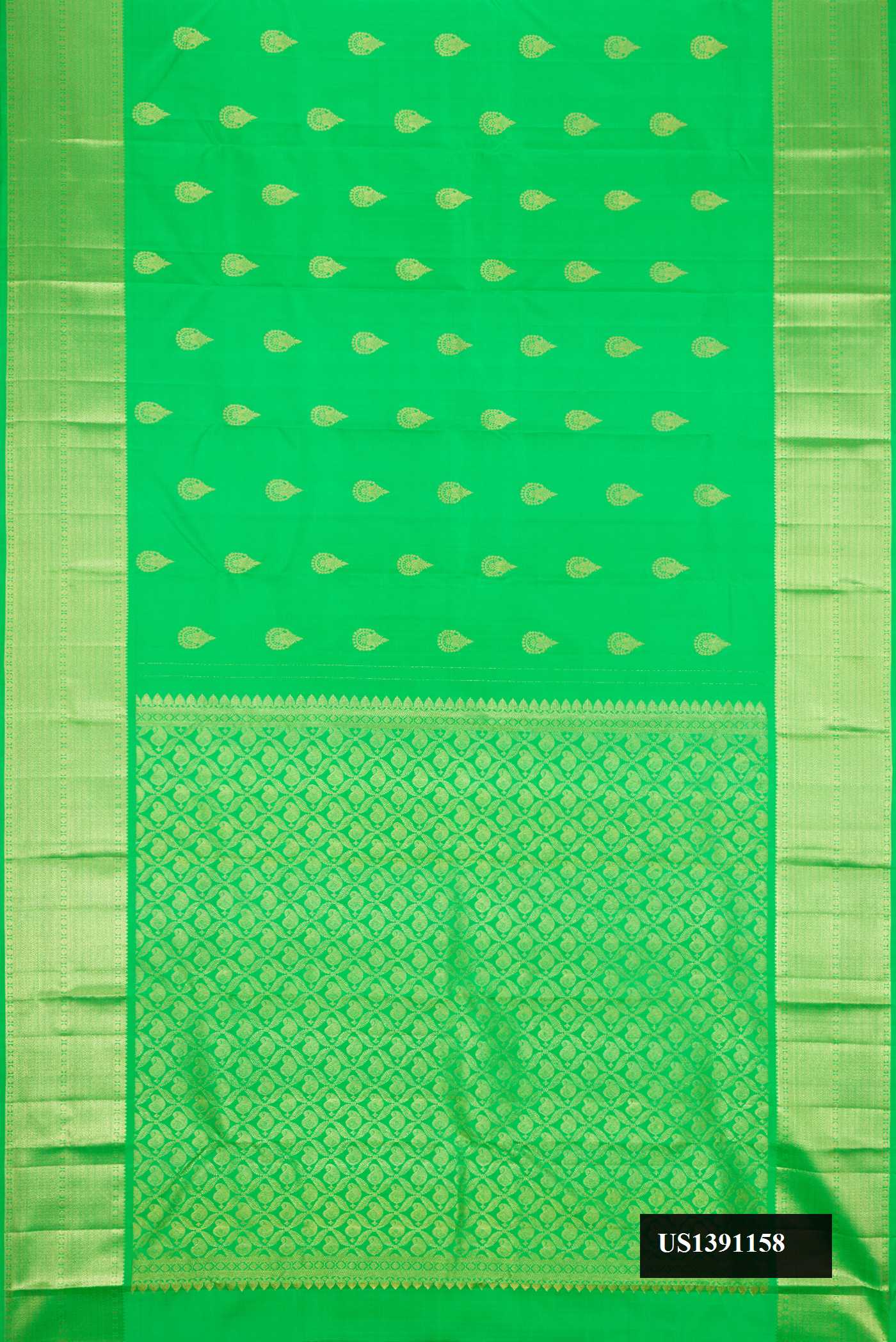 Green Dual Tone Kanchipuram Silk Saree with Zari Butta on the body and Zari Border.  displayed on a mannequin