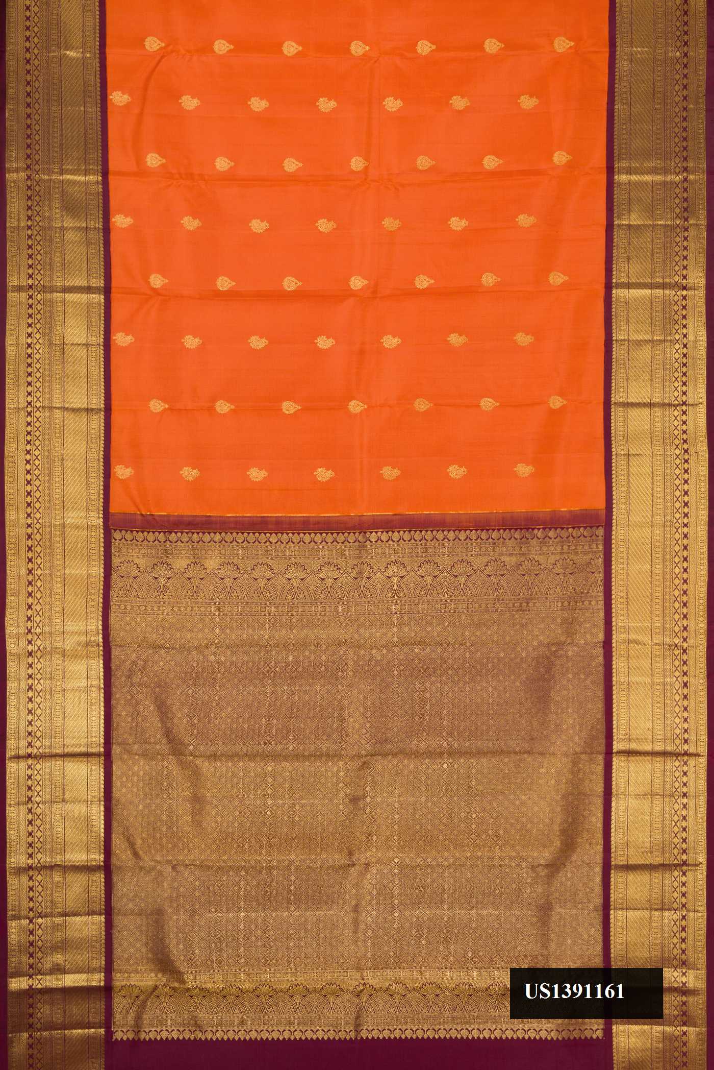 Orange Dual Tone Kanchipuram Silk Saree with Zari Butta on the body and Zari Border.  displayed on a mannequin