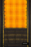 Mustard Dual Tone Kanchipuram Silk Saree with Checked design on the body and Temple Border.  displayed on a mannequin