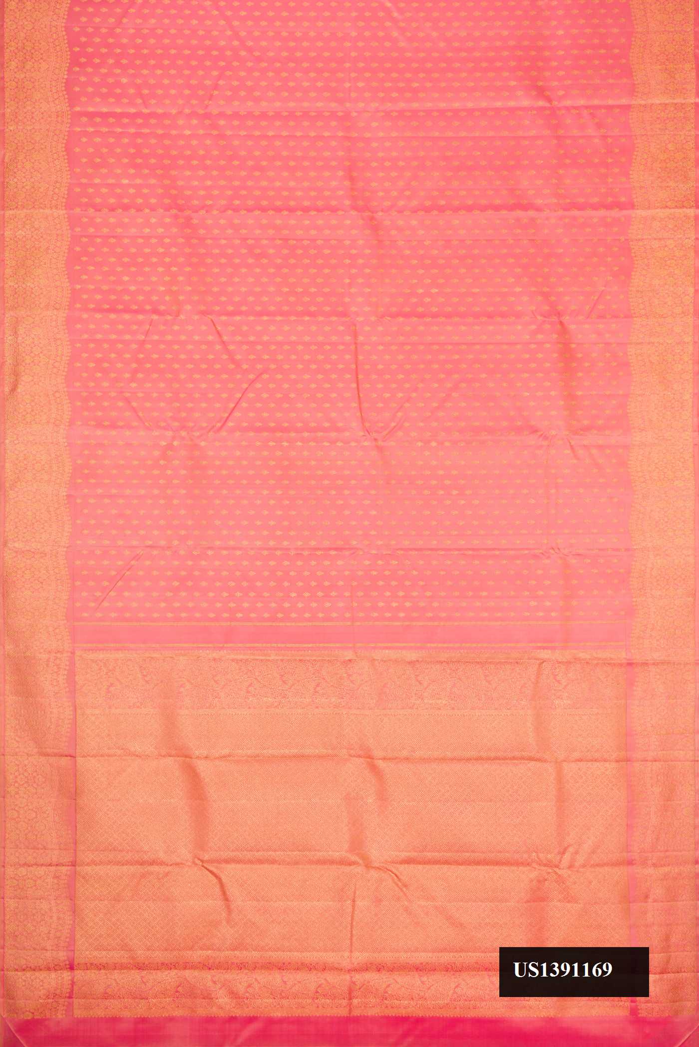 Rose Gold Dual Tone Kanchipuram Silk Saree with Zari Butta on the body and Zari Border.  displayed on a mannequin