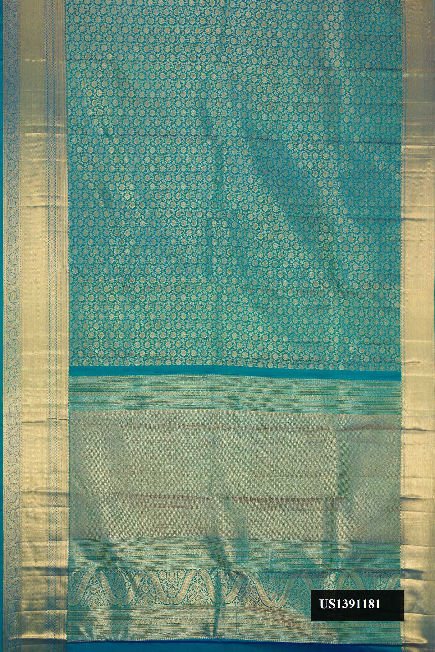 Peacock Blue Dual Tone Kanchipuram Silk Saree with Zari Brocade on the body and Zari Border.  displayed on a mannequin