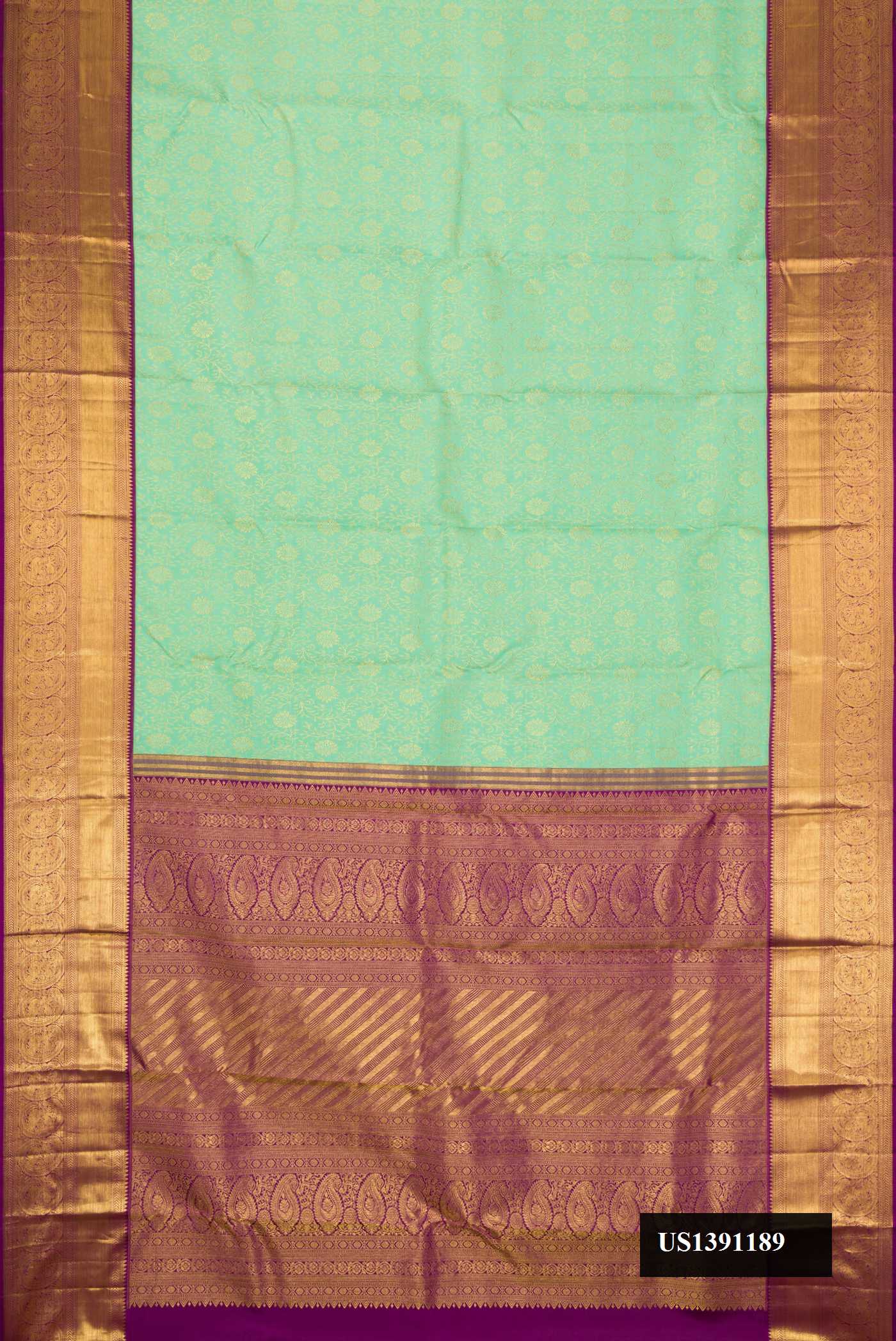 Sea Green Dual Tone Kanchipuram Silk Saree with Zari Brocade on the body and Zari Border.  displayed on a mannequin