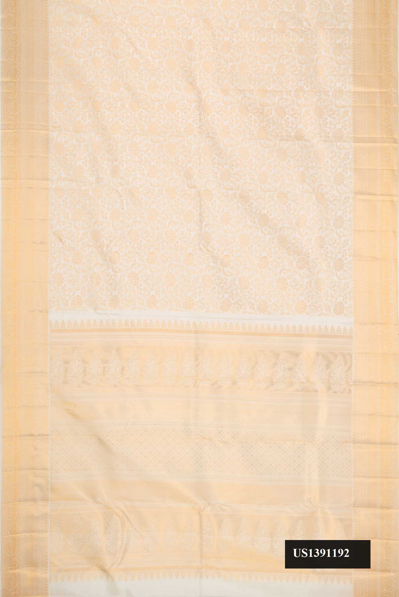 Off White Dual Tone Kanchipuram Silk Saree with Zari Brocade on the body and Zari Border.  displayed on a mannequin