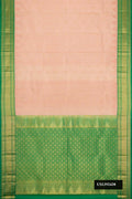 Rose Gold Dual Tone Kanchipuram Silk Saree with Zari Butta on the body and Zari Border.  displayed on a mannequin