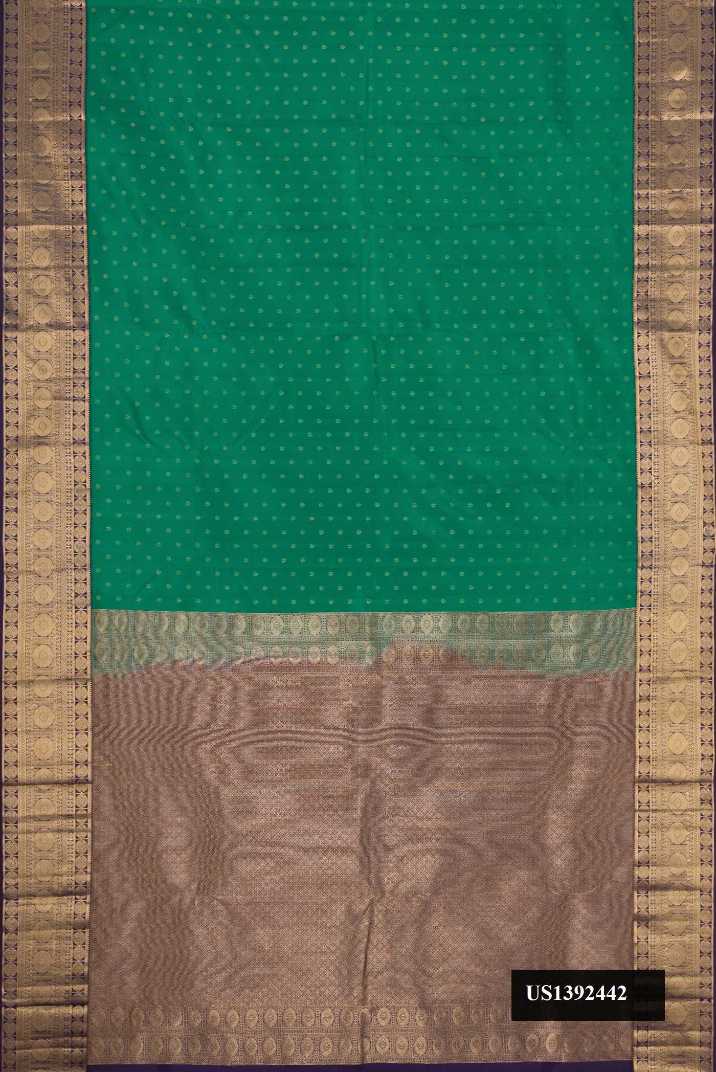 Green Dual Tone Kanchipuram Silk Saree with Zari Butta on the body and Zari Border.  displayed on a mannequin