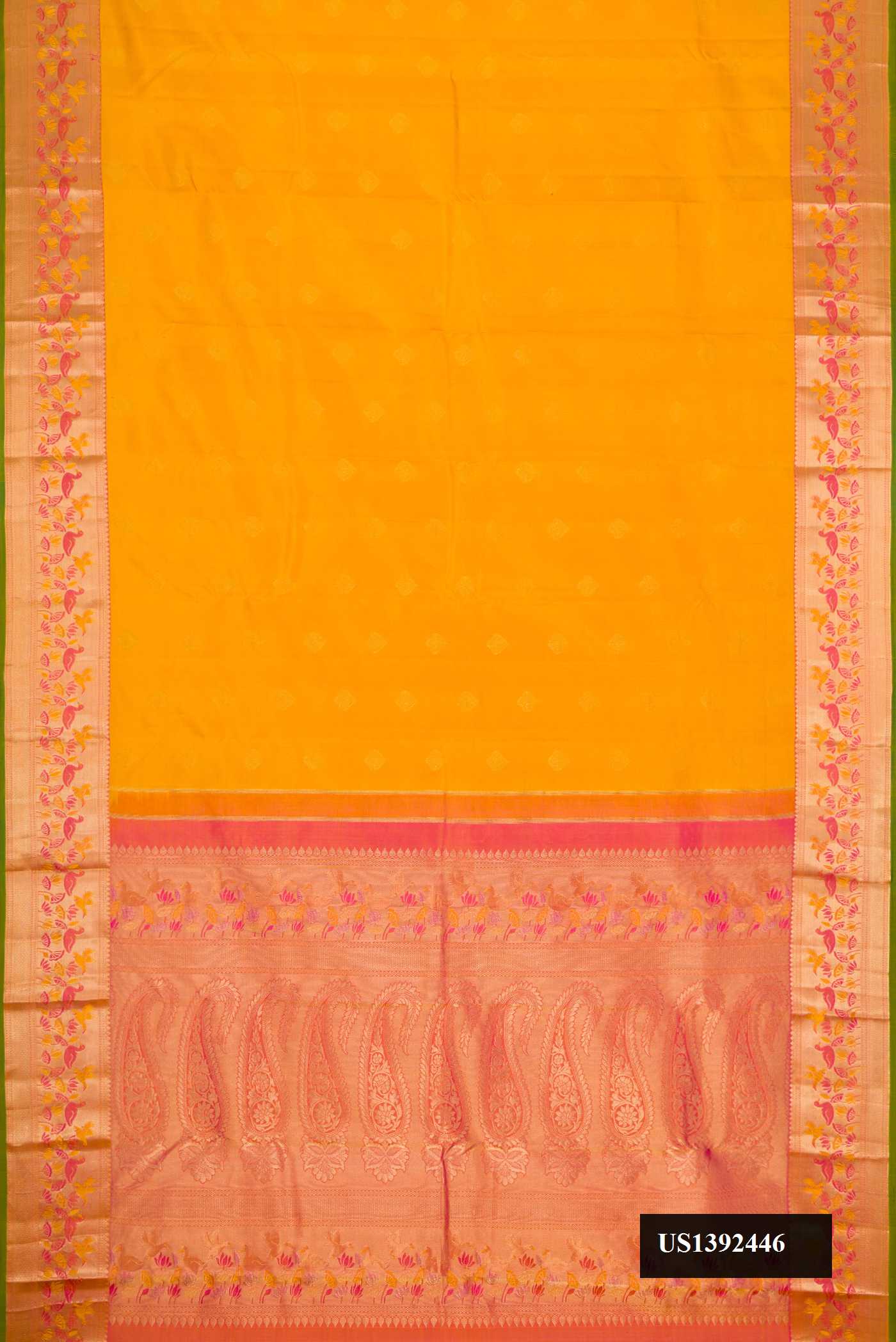 Mustard Dual Tone Kanchipuram Silk Saree with Zari Butta on the body and Zari Border.  displayed on a mannequin