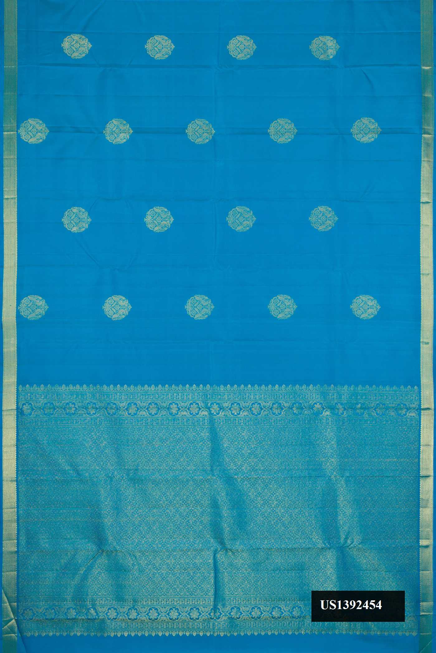Peacock Blue Dual Tone Kanchipuram Silk Saree with Zari Butta on the body and Zari Border.  displayed on a mannequin