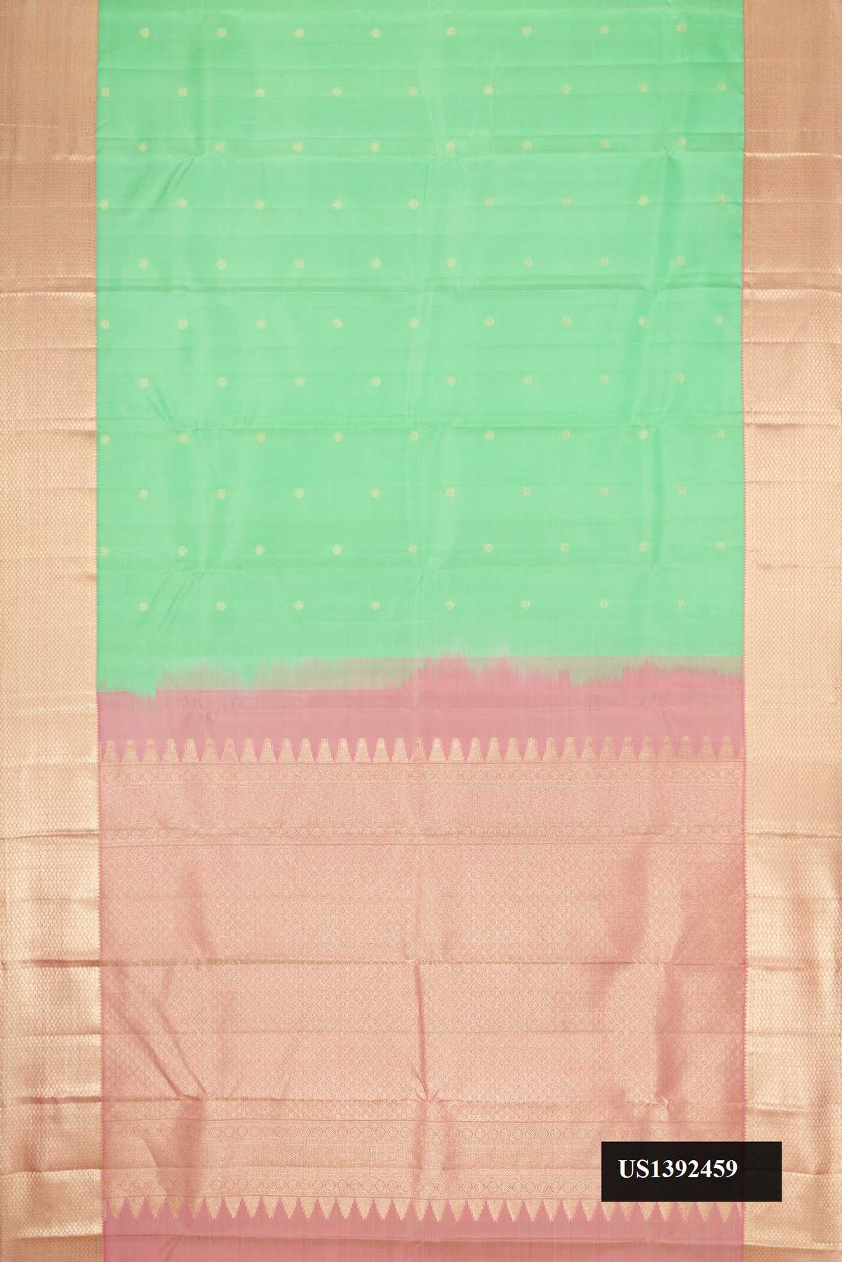 Light Green Dual Tone Kanchipuram Silk Saree with Zari Butta on the body and Zari Border.  displayed on a mannequin