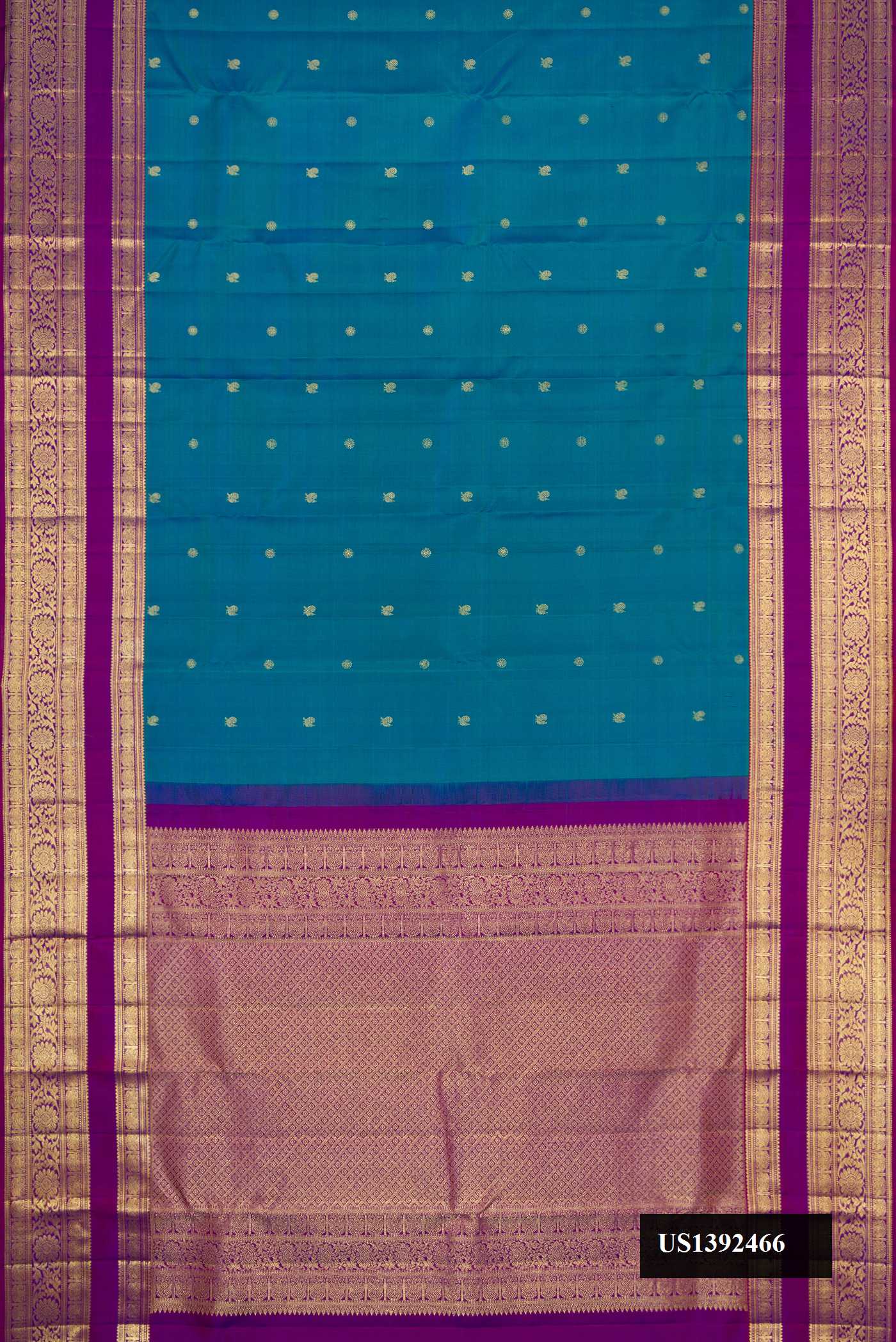 Peacock Blue Dual Tone Kanchipuram Silk Saree with Zari Butta on the body and Zari Border.  displayed on a mannequin