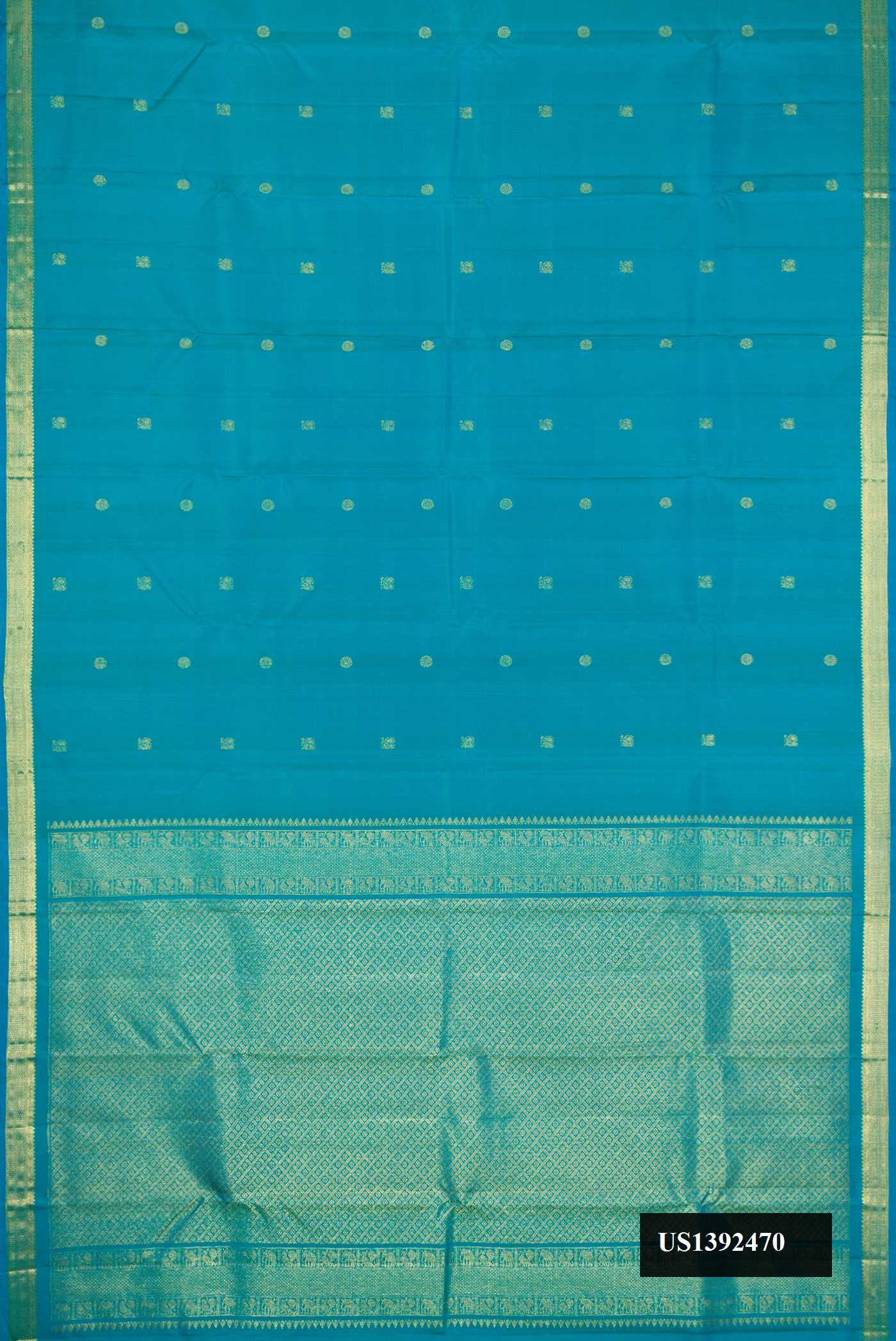 Peacock Blue Dual Tone Kanchipuram Silk Saree with Zari Butta on the body and Zari Border.  displayed on a mannequin