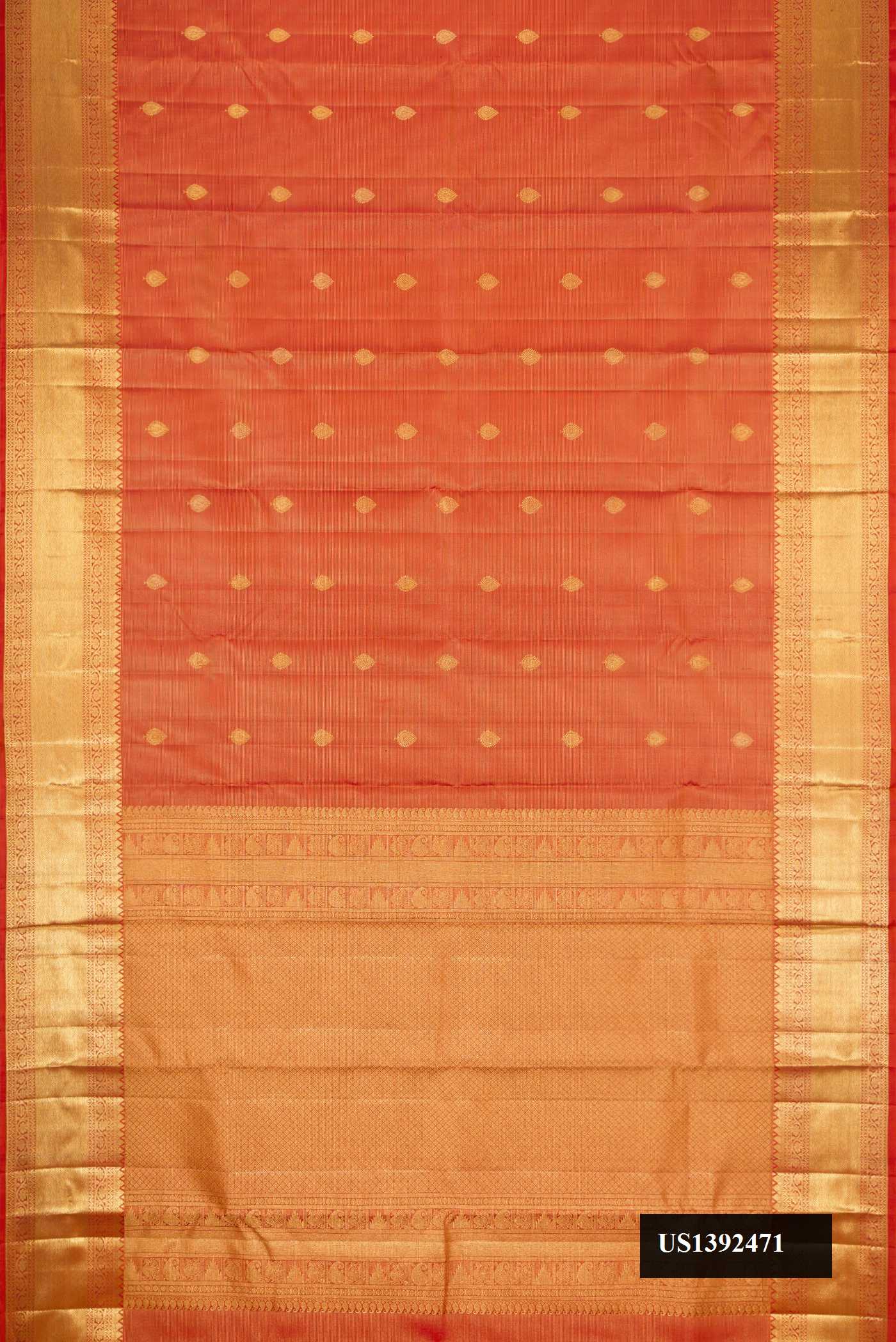 Brick Orange Dual Tone Kanchipuram Silk Saree with Zari Butta on the body and Zari Border.  displayed on a mannequin