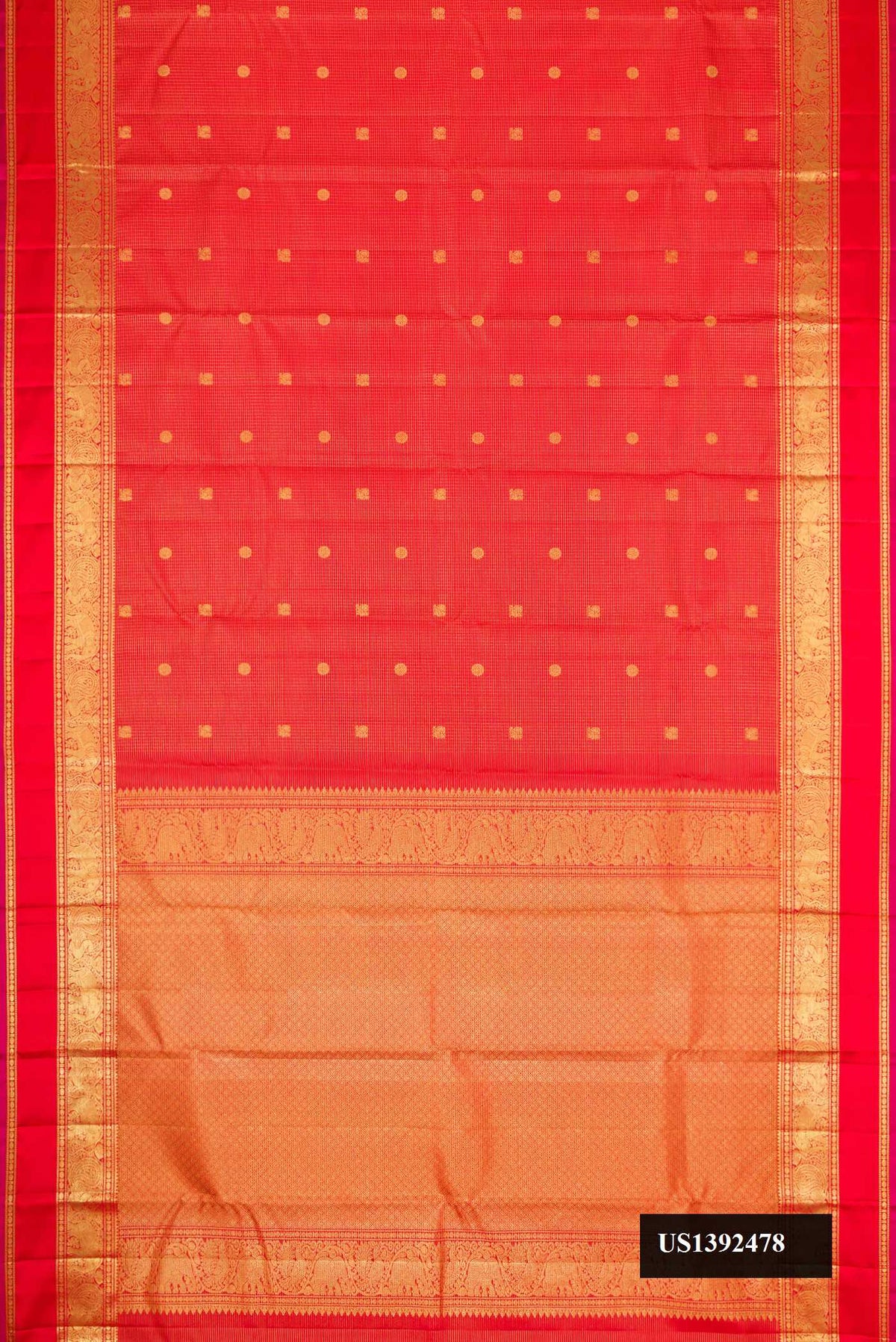 Brick Orange Dual Tone Kanchipuram Silk Saree with Zari Butta on the body and Zari Border.  displayed on a mannequin