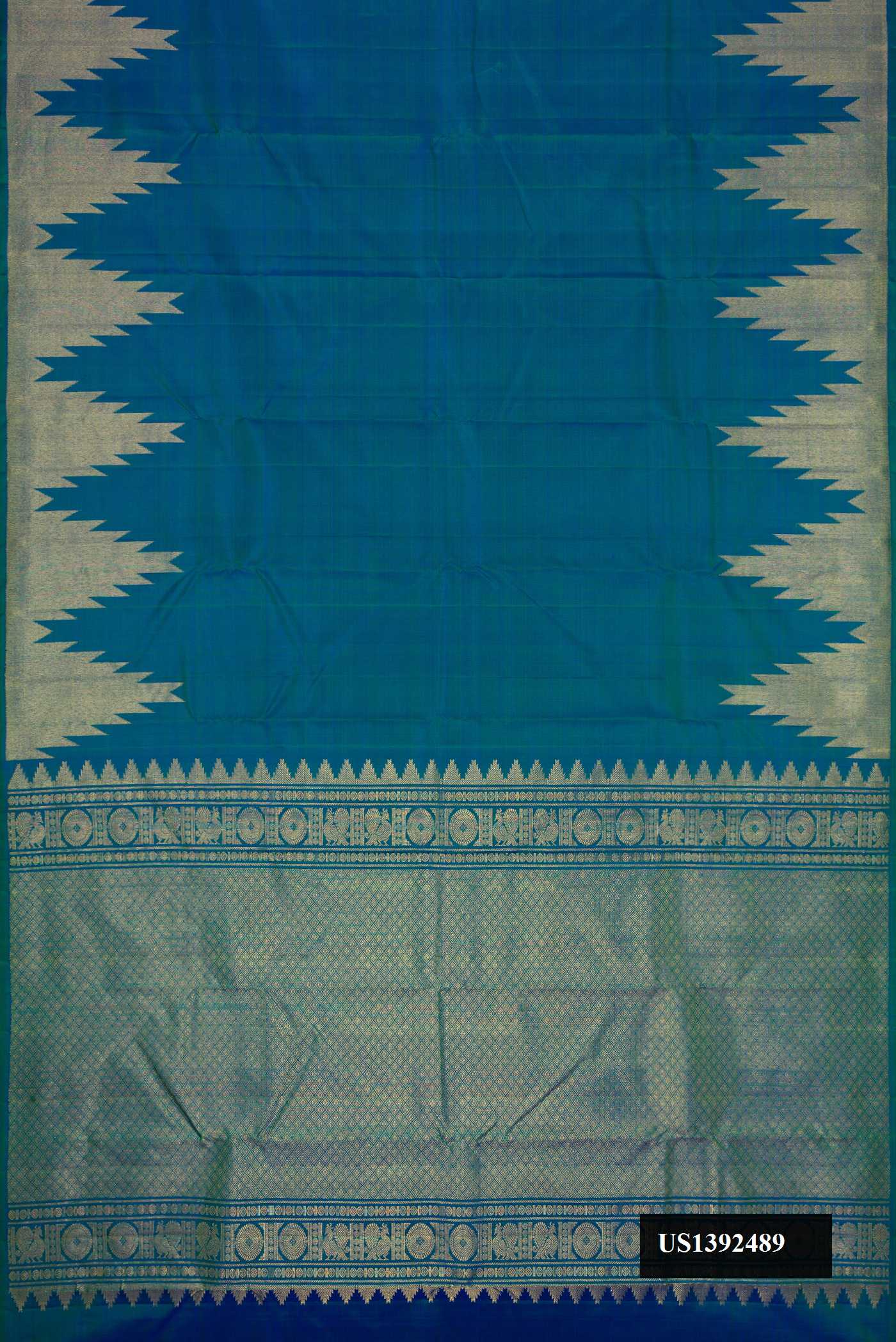 Peacock Blue Dual Tone Kanchipuram Silk Saree with Plain Body and Temple Border.  displayed on a mannequin