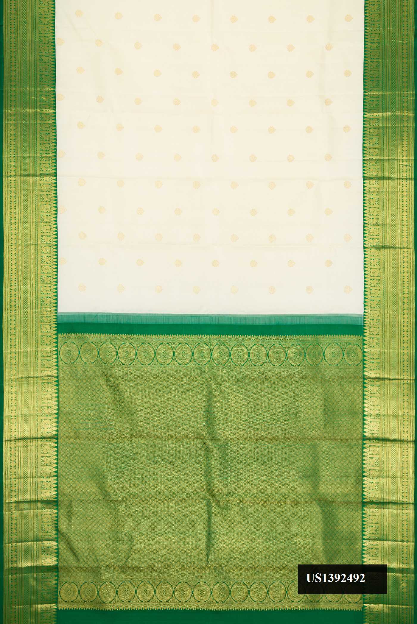 Sandal Dual Tone Kanchipuram Silk Saree with Zari Butta on the body and Zari Border.  displayed on a mannequin