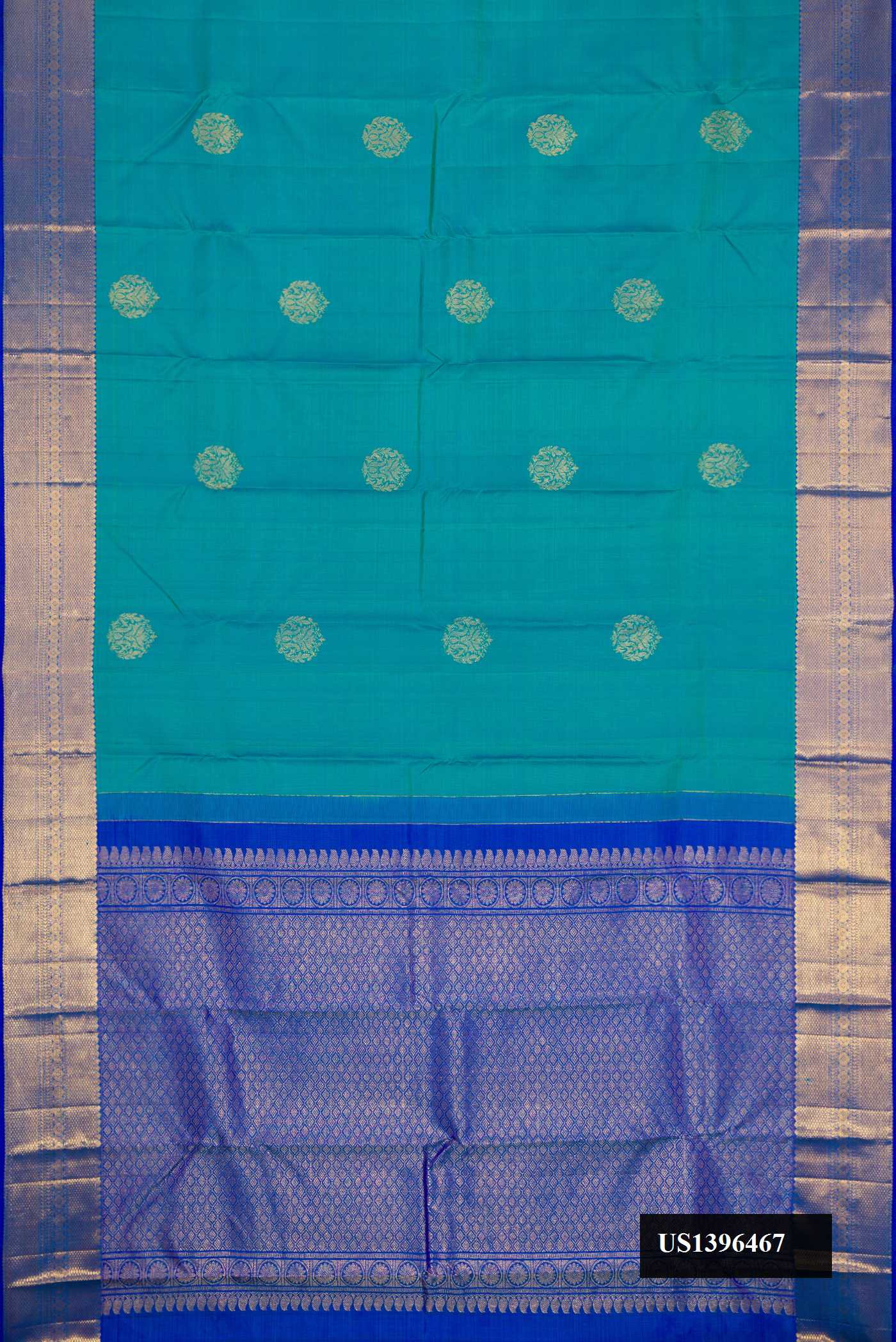 Peacock Blue Dual Tone Kanchipuram Silk Saree with Zari Butta on the body and Zari Border.  displayed on a mannequin