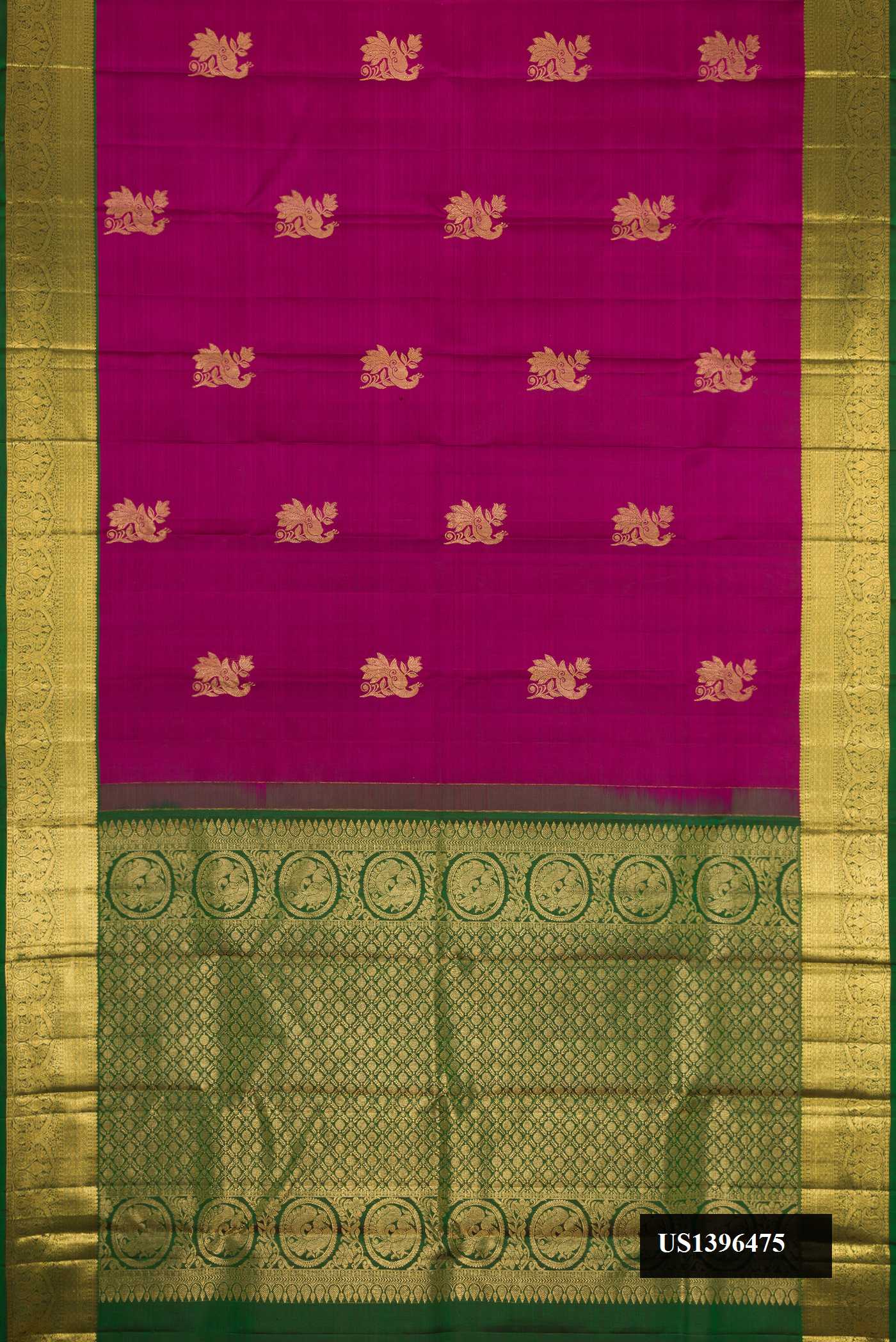 Magenta Dual Tone Kanchipuram Silk Saree with Zari Butta on the body and Zari Border.  displayed on a mannequin