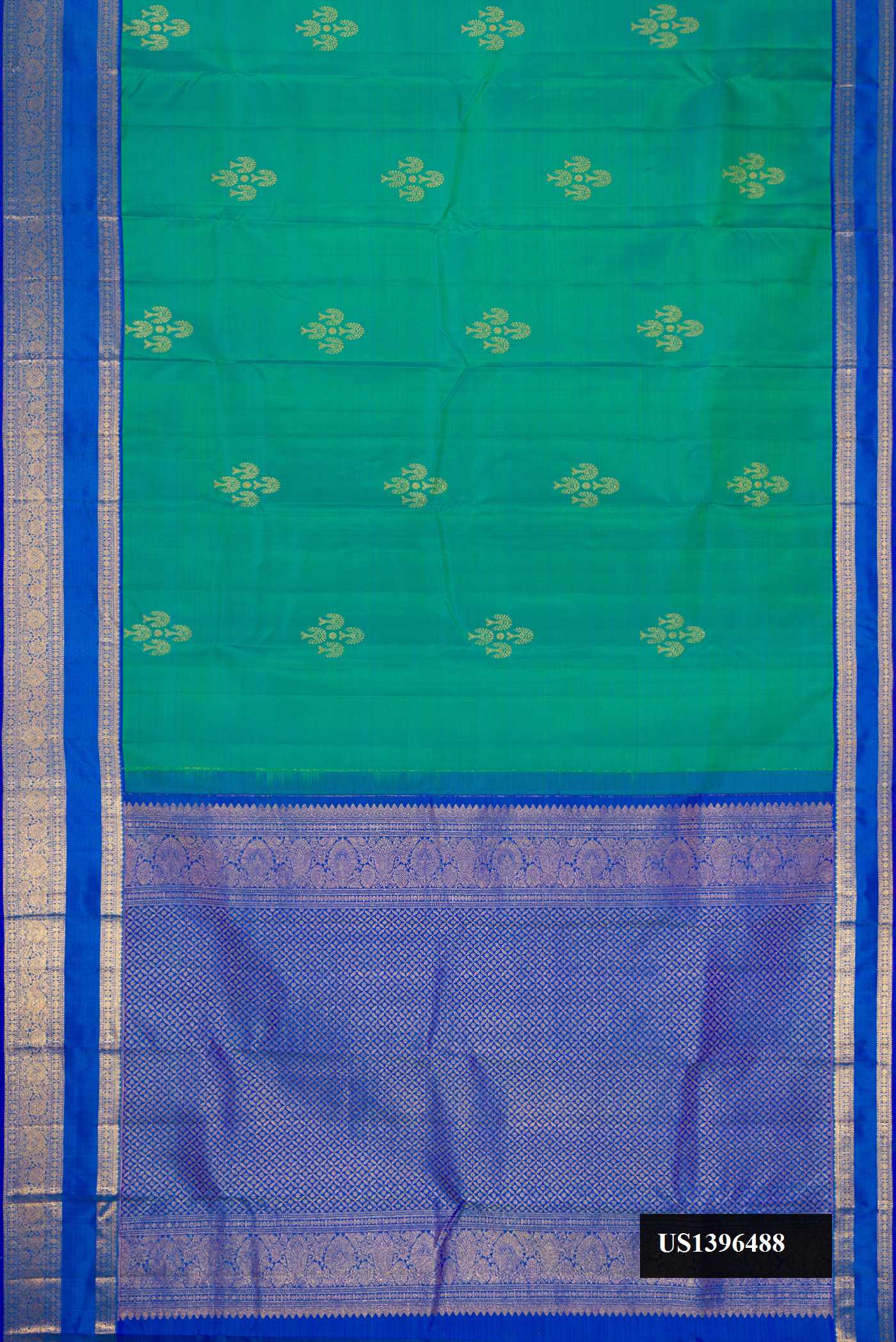 Green Dual Tone Kanchipuram Silk Saree with Zari Butta on the body and Zari Border.  displayed on a mannequin