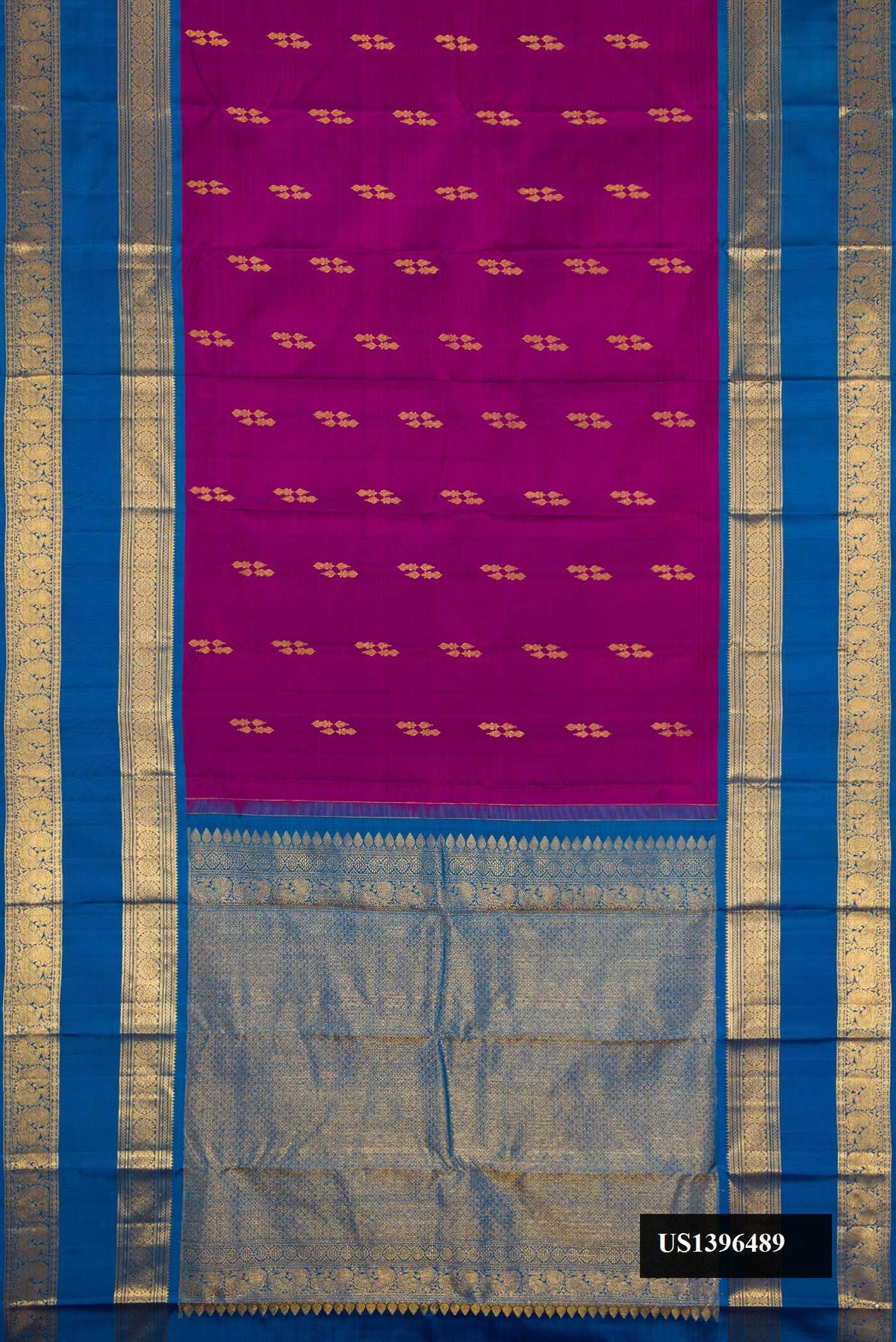 Magenta Dual Tone Kanchipuram Silk Saree with Zari Butta on the body and Zari Border.  displayed on a mannequin