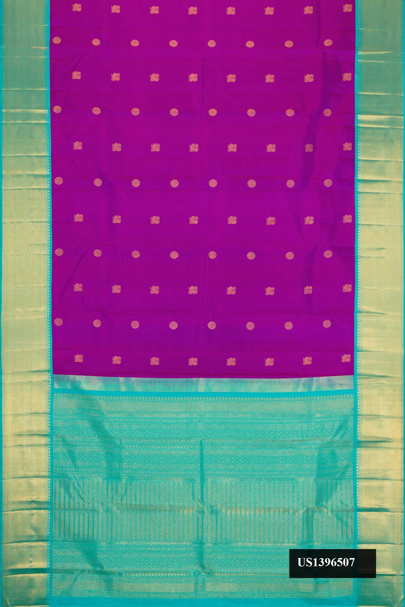 Magenta Dual Tone Kanchipuram Silk Saree with Zari Butta on the body and Zari Border.  displayed on a mannequin