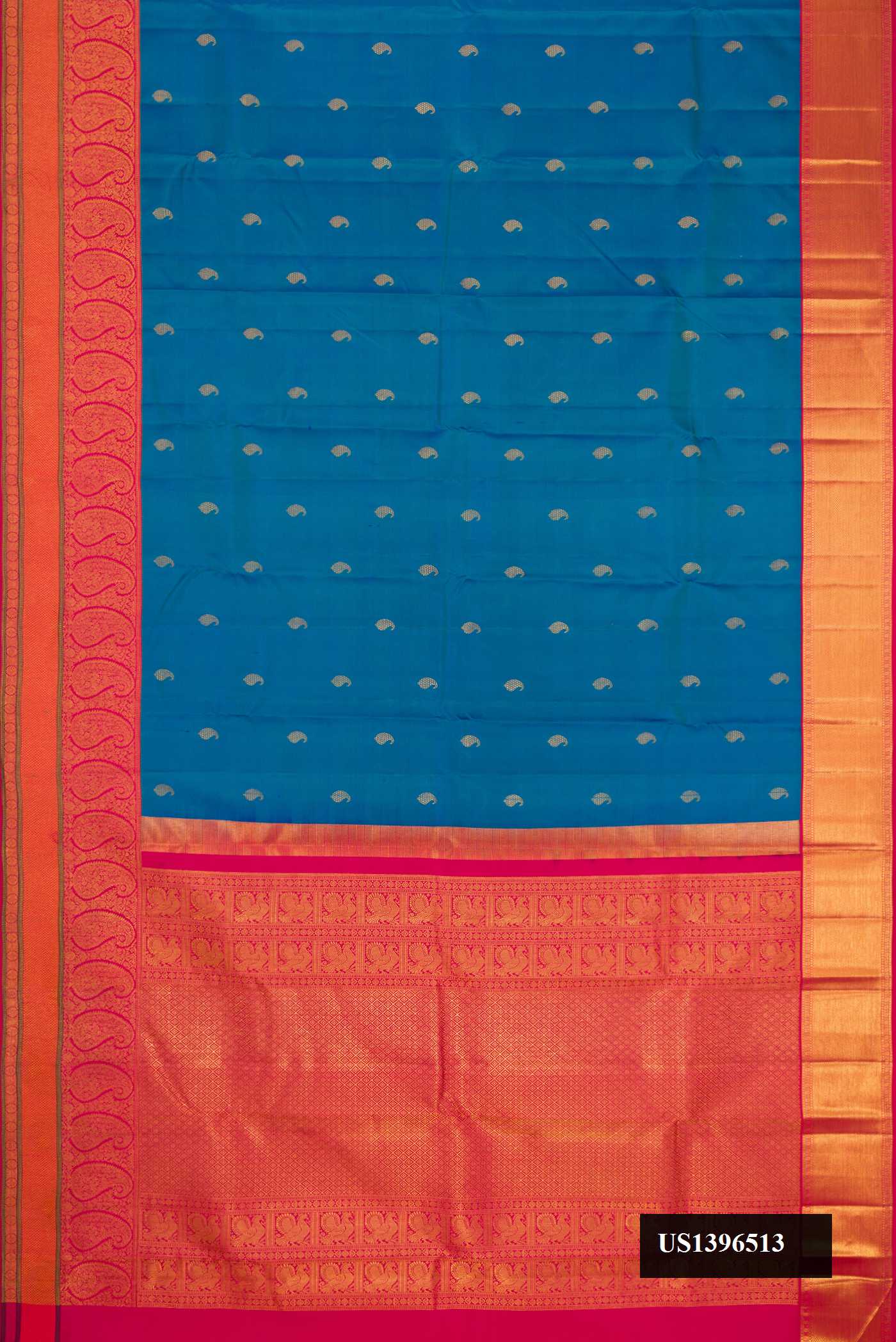 Peacock Blue Dual Tone Kanchipuram Silk Saree with Zari Butta on the body and Zari Border.  displayed on a mannequin