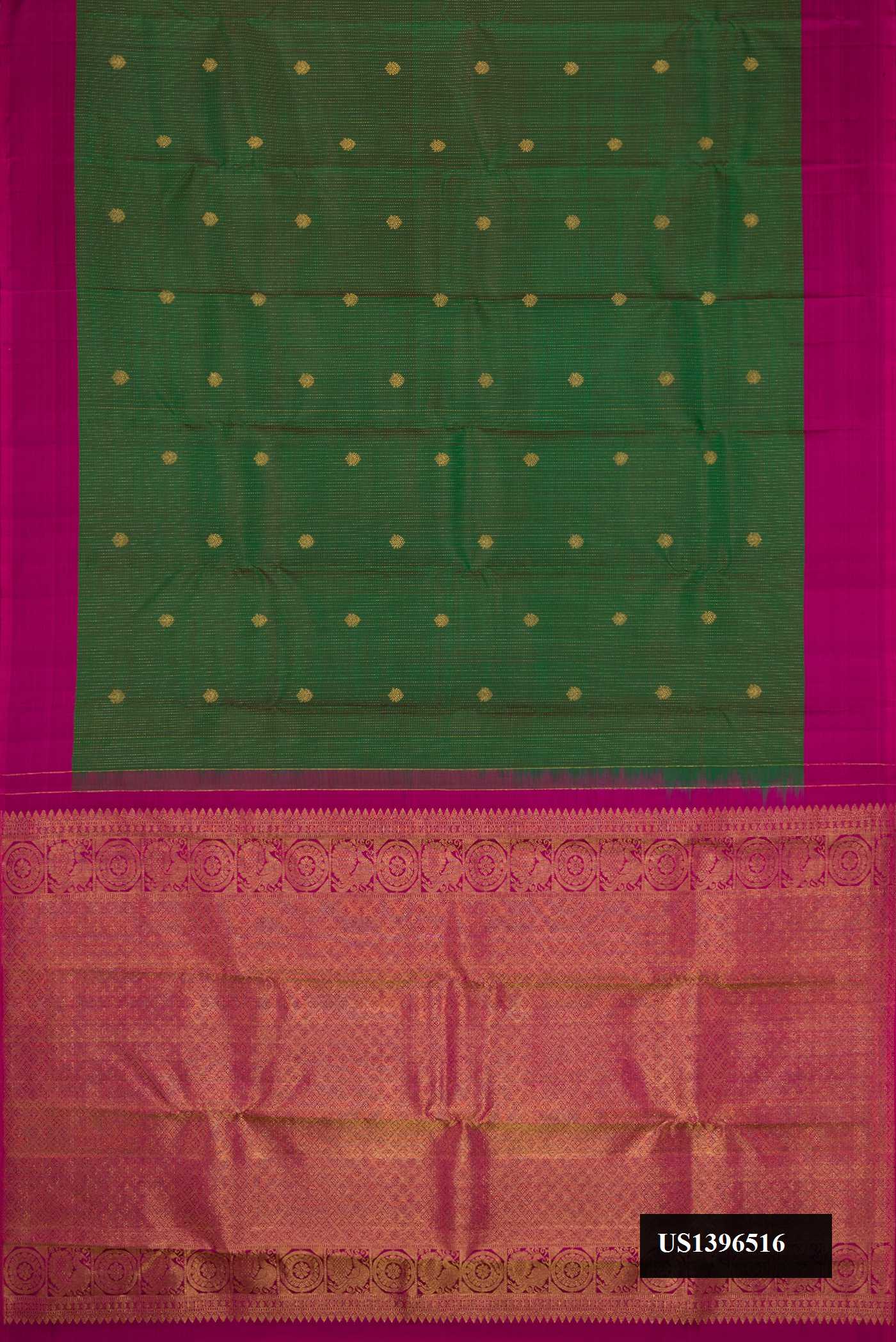 Green Dual Tone Kanchipuram Silk Saree with Zari Butta on the body and Plain Border.  displayed on a mannequin