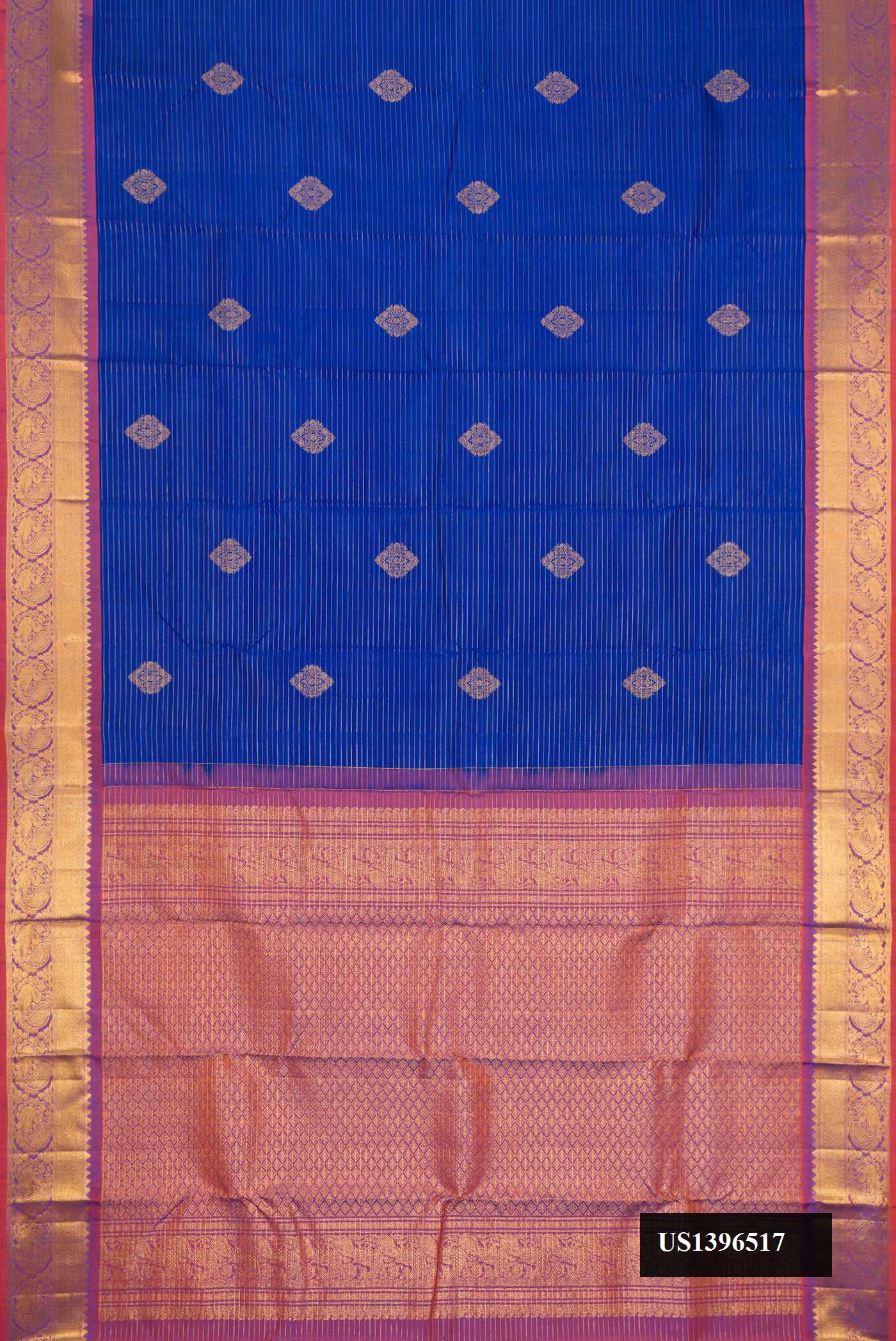 Royal Blue Dual Tone Kanchipuram Silk Saree with Stripes on the body and Zari Border.  displayed on a mannequin