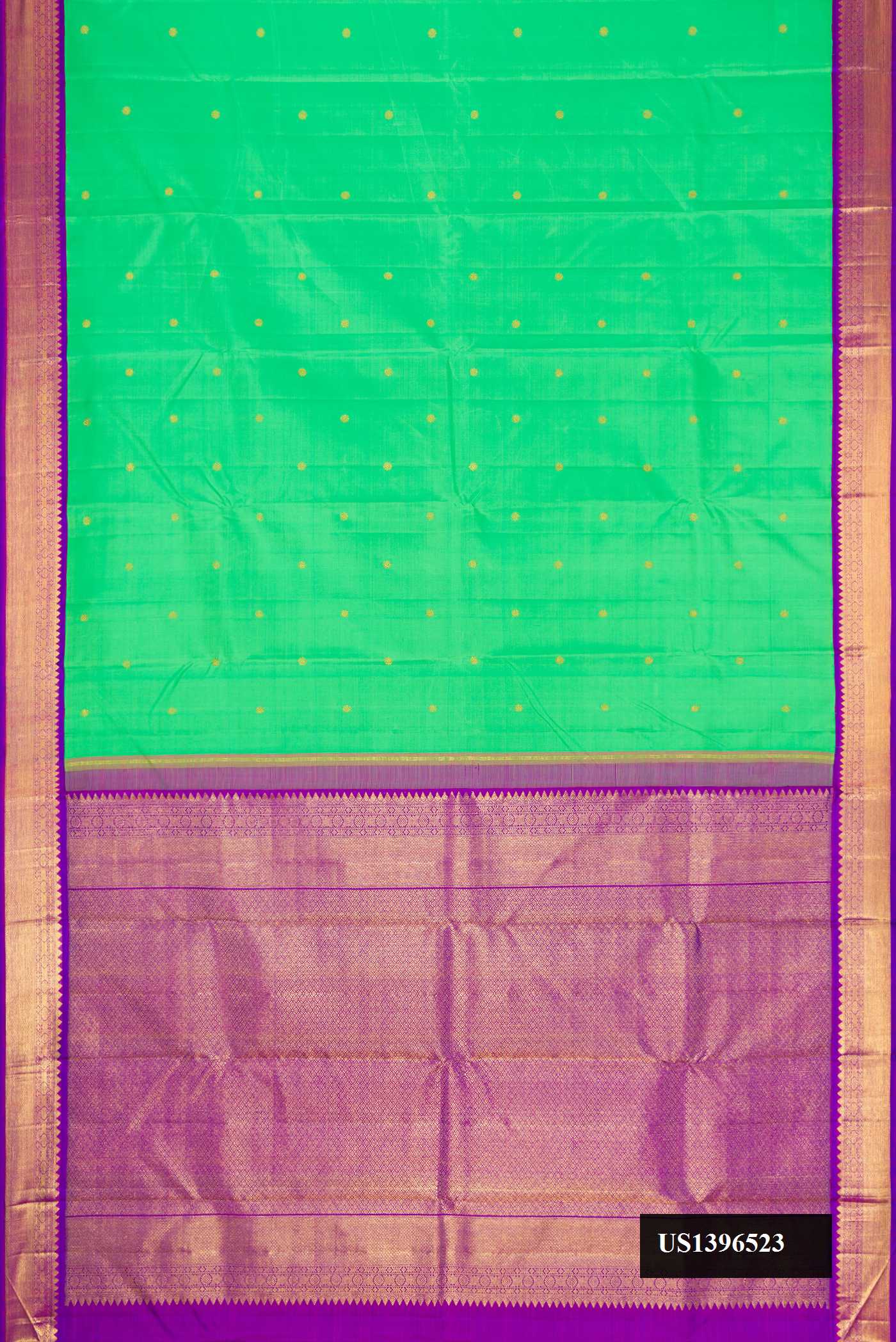 Green Dual Tone Kanchipuram Silk Saree with Zari Butta on the body and Zari Border.  displayed on a mannequin