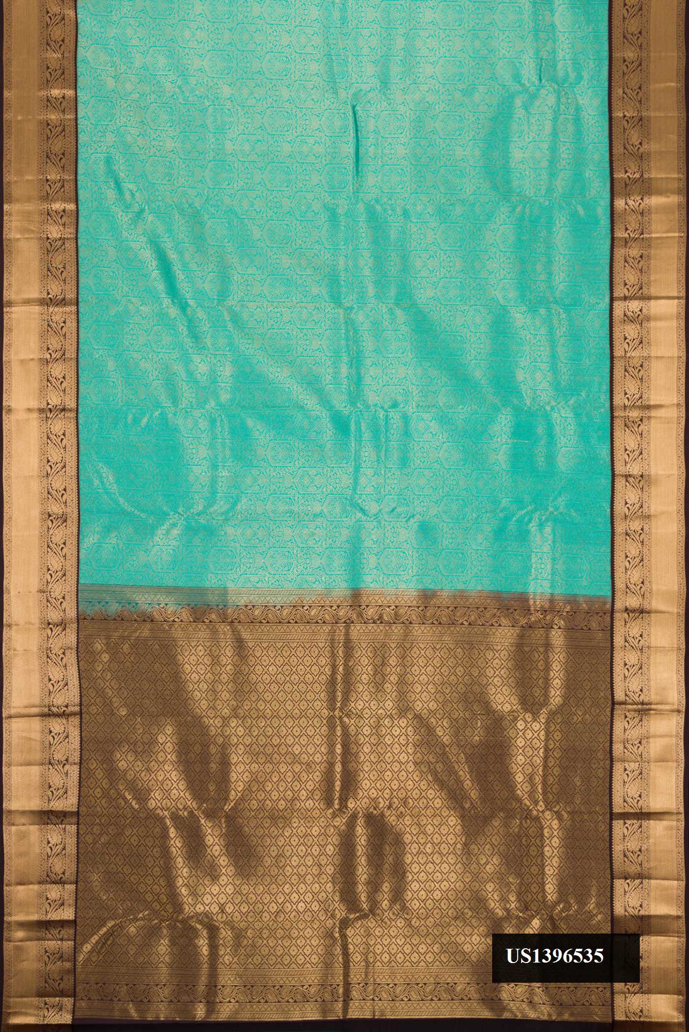 Sea Green Dual Tone Kanchipuram Silk Saree with Zari Brocade on the body and Zari Border.  displayed on a mannequin