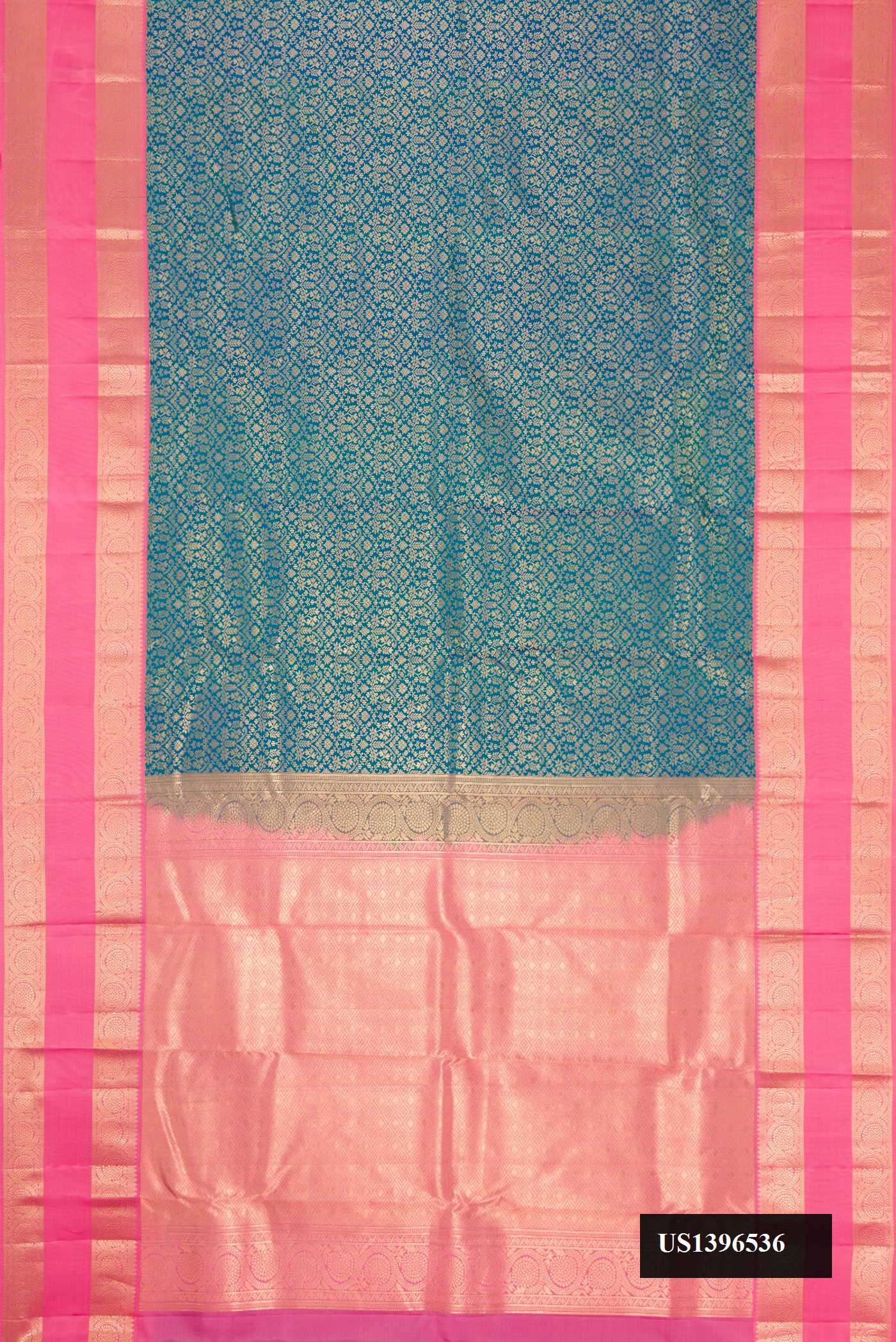 Peacock Blue Dual Tone Kanchipuram Silk Saree with Zari Brocade on the body and Zari Border.  displayed on a mannequin